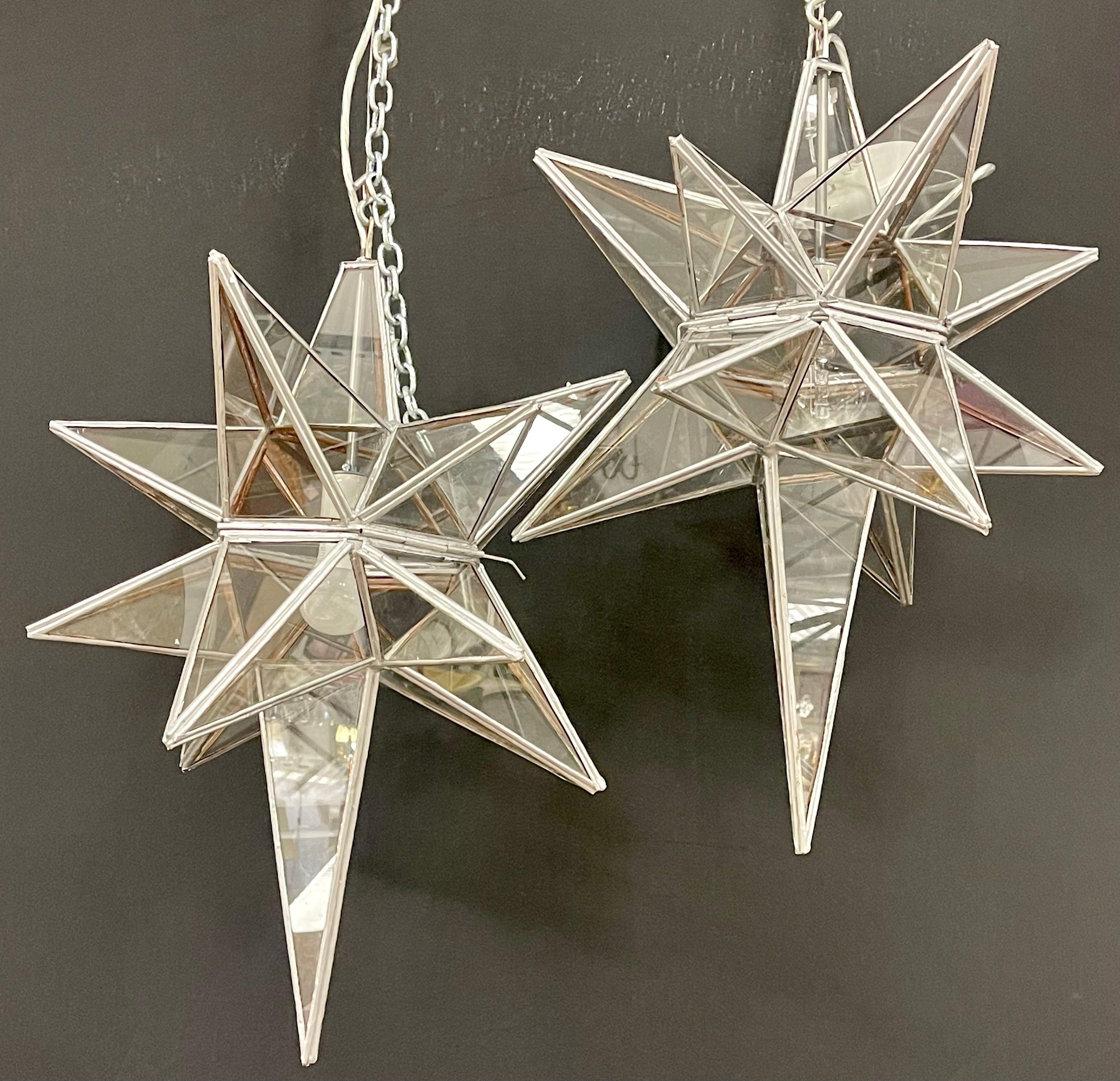 Pair of Sputnik star light fixtures glass Art Deco style. Each with a matching chair and canopy. Tucker Robbins Star Lights in a custom pewter finish.


RitaTeichnerIZXA.