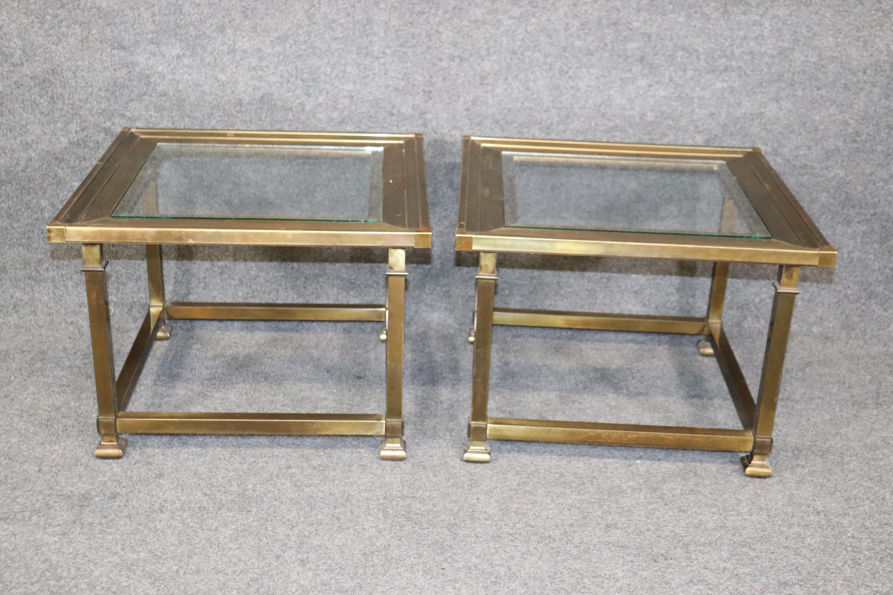 Dimensions- H: 16in W: 22in D: 22in 
This Pair of Square Brass And Glass Top Mastercraft End Tables are made of the highest quality and are perfect for you and your home! If you take a look at the photos provided you will see the aged and tarnished
