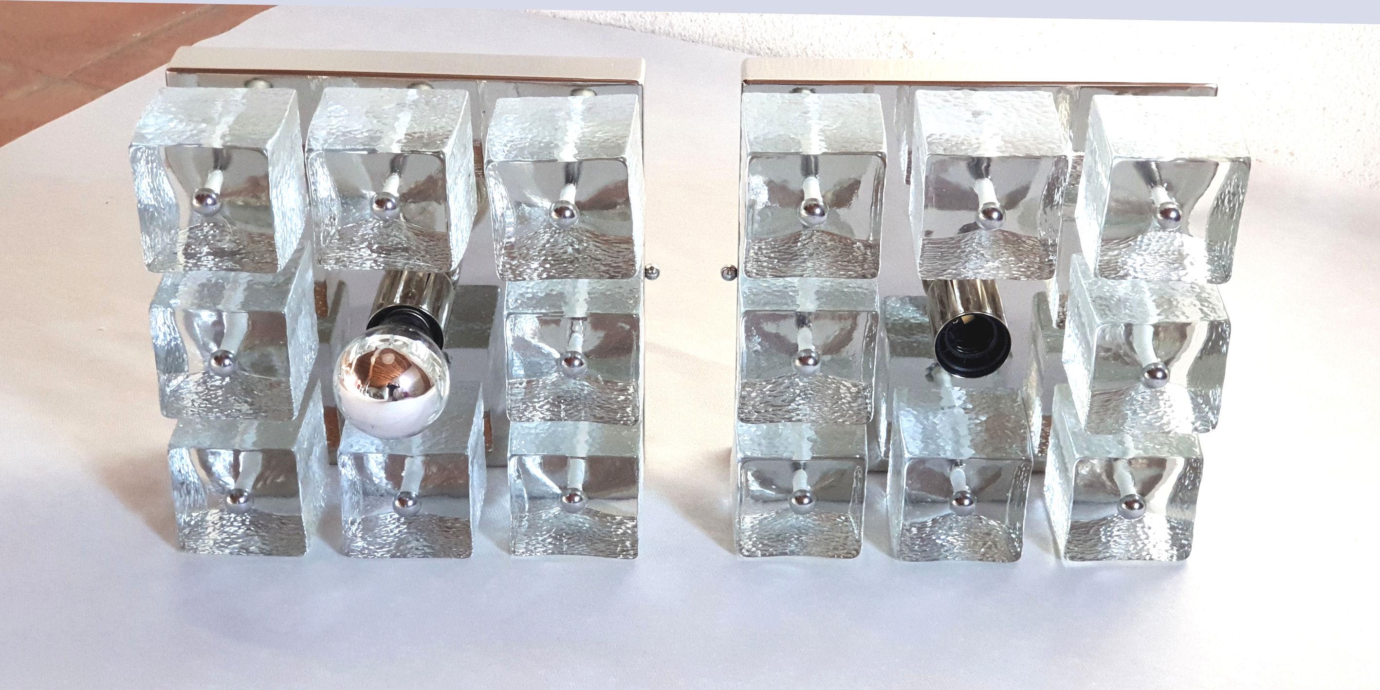 Pair of square wall sconces or flush mount lights, in chrome and Murano clear glass cubes.
Glasses are from an old Gaetano Sciolari stock, circa 1970s.
Chrome frames are new.
1 light each, newly wired for the US.
 
