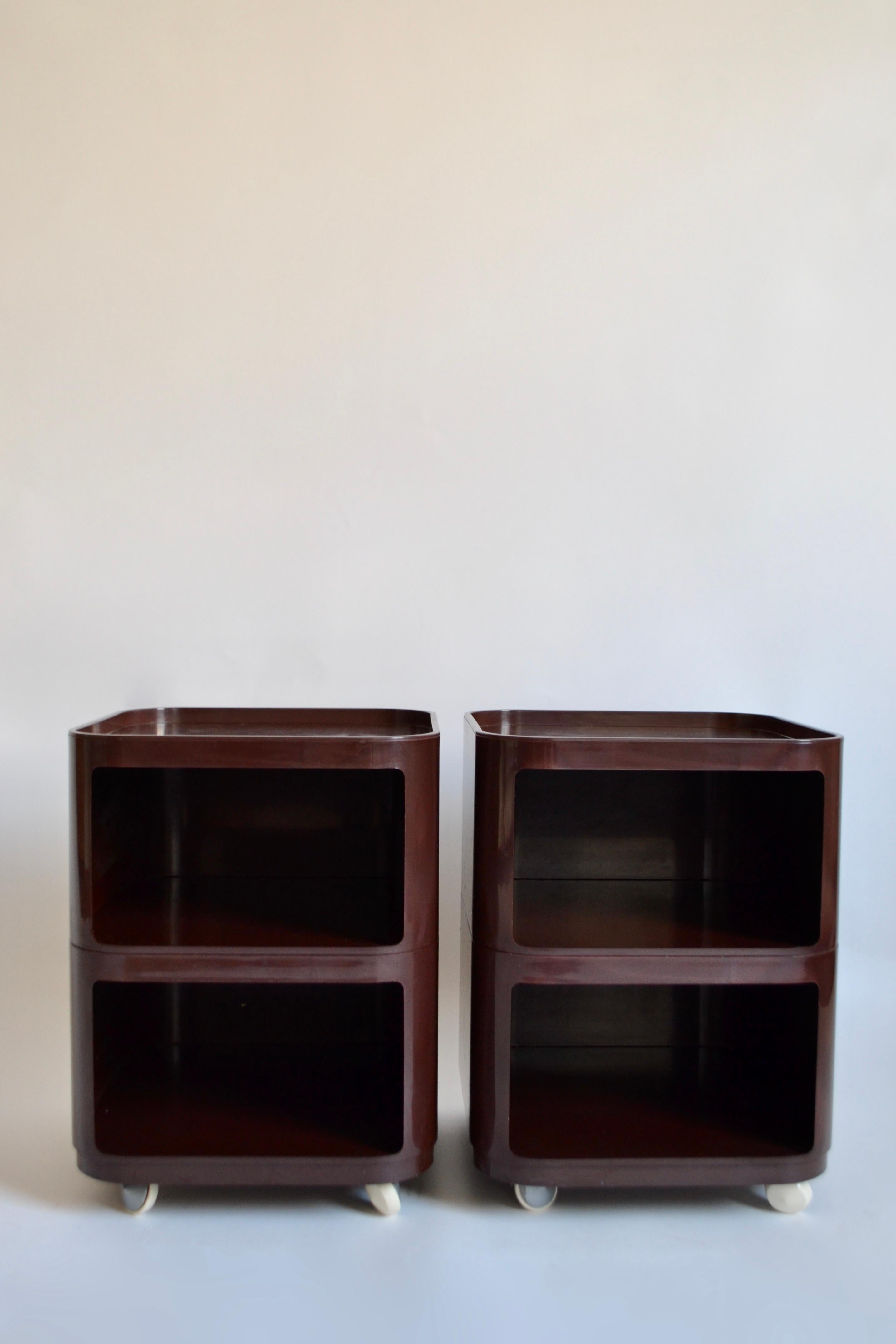 Pair of vintage square Combonibili units in a dark aubergine / purple colour designed by Anna Castelli Ferrieri for Kartell and manufactured in the 1970s. Good vintage condition. Four wheels at base of each unit for easy movement. Attribution marks