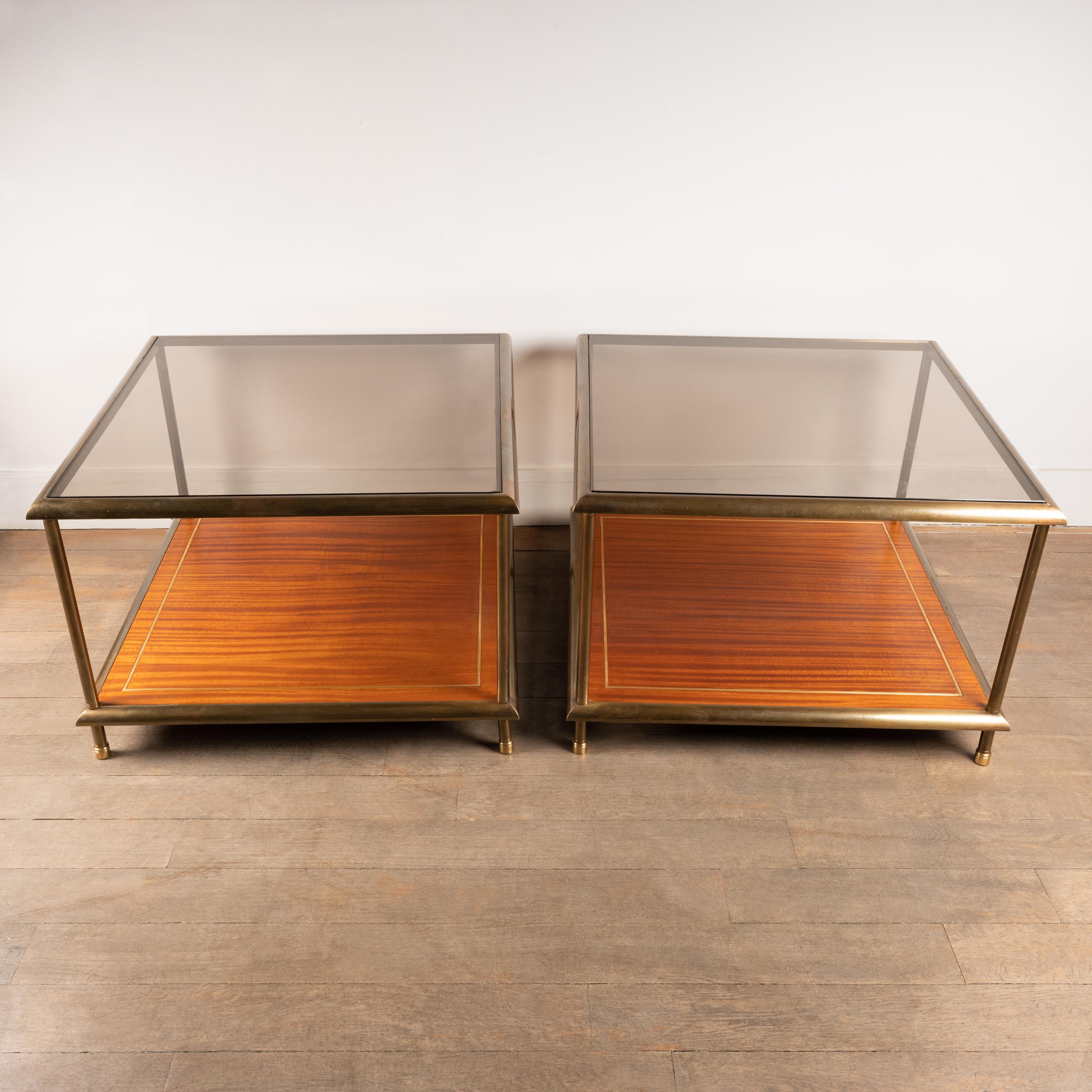 Pair of square side tables composed of two trays.
The top tray is made of glass and the bottom tray of
mahogany.
Structure in brass.
France, 1960s

Dimension :
Height : 49 cm / 19,29 inch
Width / depth : 70 cm / 27,55 inch.