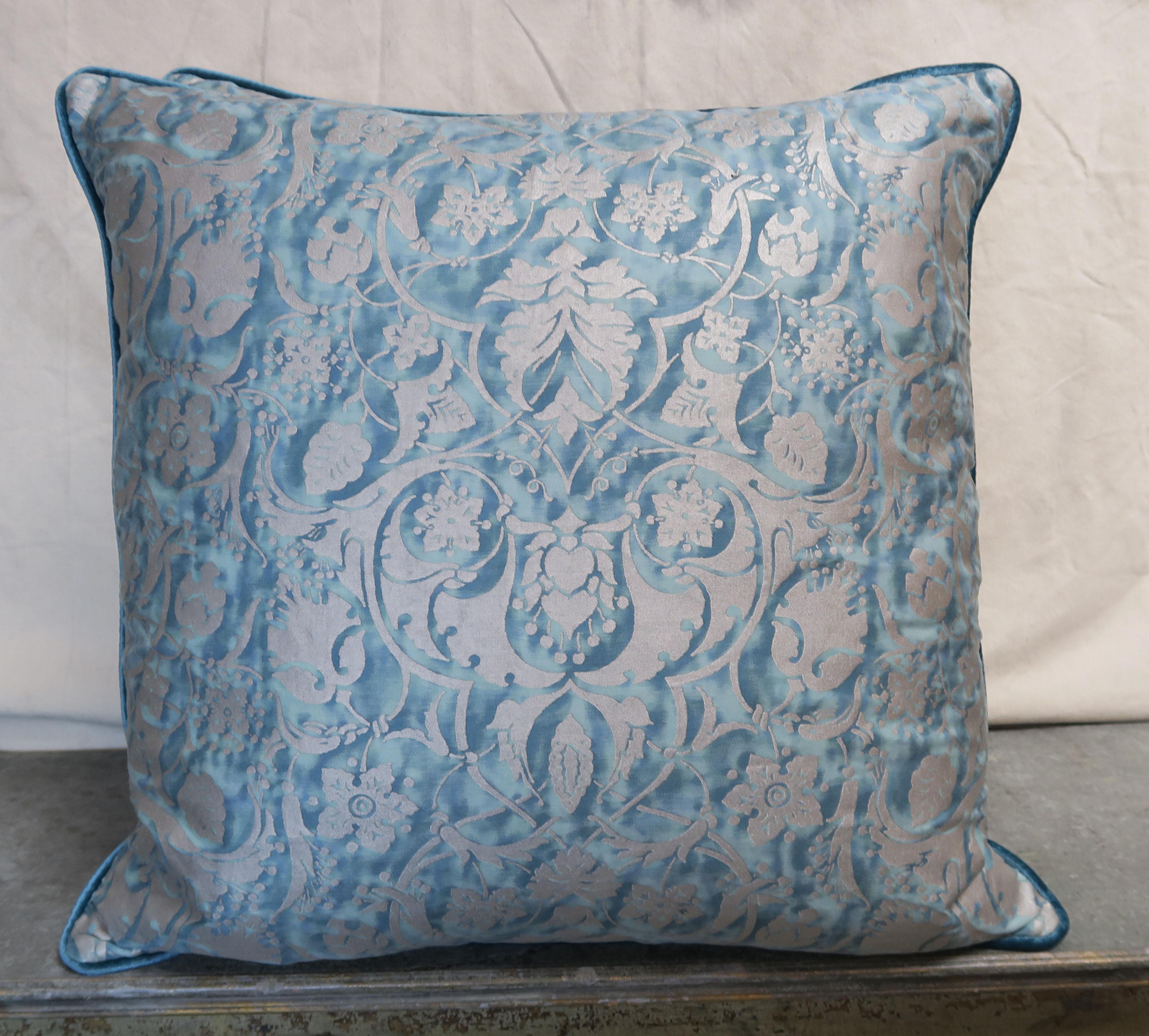 Pair of custom pillows made with Persepolis patterned Fortuny textile fronts in blue/green and silvery gold. Striking blue linen velvet backs with self cord detail. Down inserts, sewn closed.