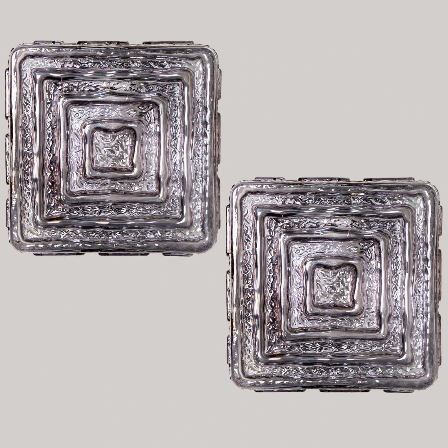 Beautiful high quality light fixture in the style with a beautiful motif . Manufactured in Mid-century, circa 1970 (at the end of 1960s and beginning of 1970s).

This flush mount or wall light features lights are made of handmade frosted grey glass