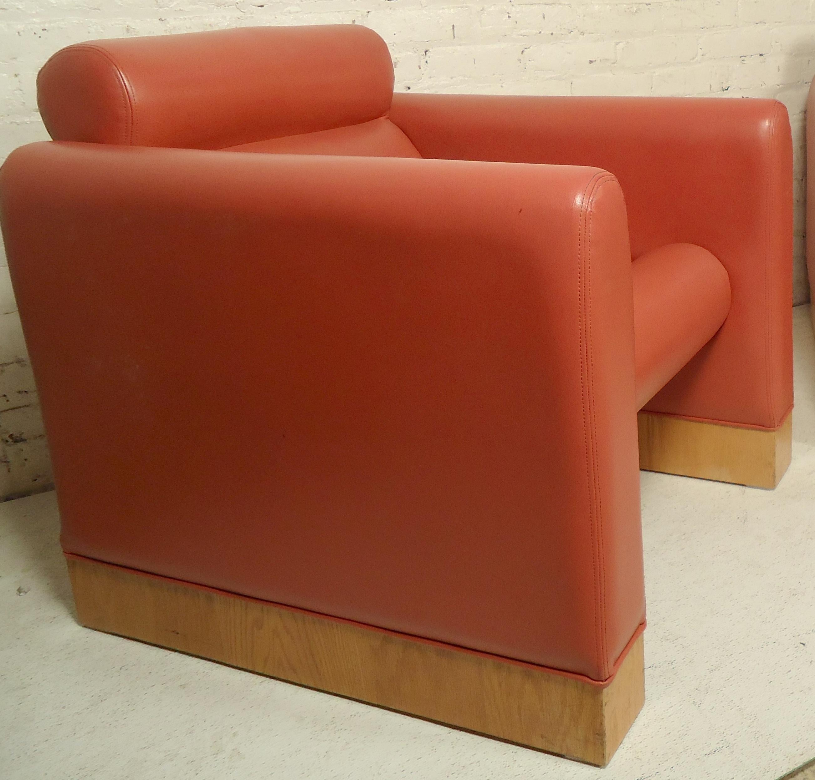 Vintage leather lounge chairs with wood trim. 

(Please confirm item location - NY or NJ - with dealer).
 