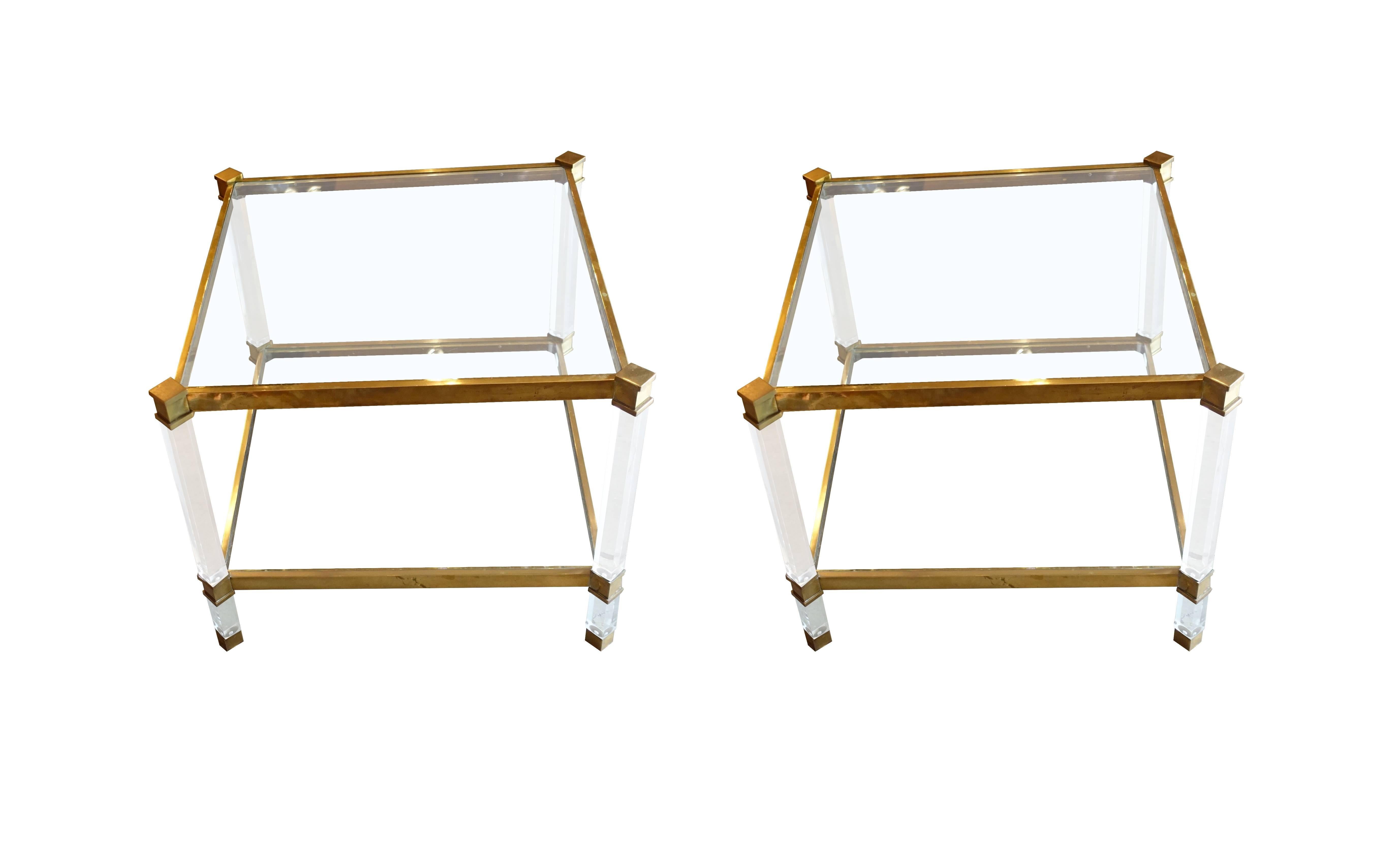 1960s French pair of angled square lucite column legged coffee tables. 
Brass trim.
Two tier with glass shelves.
