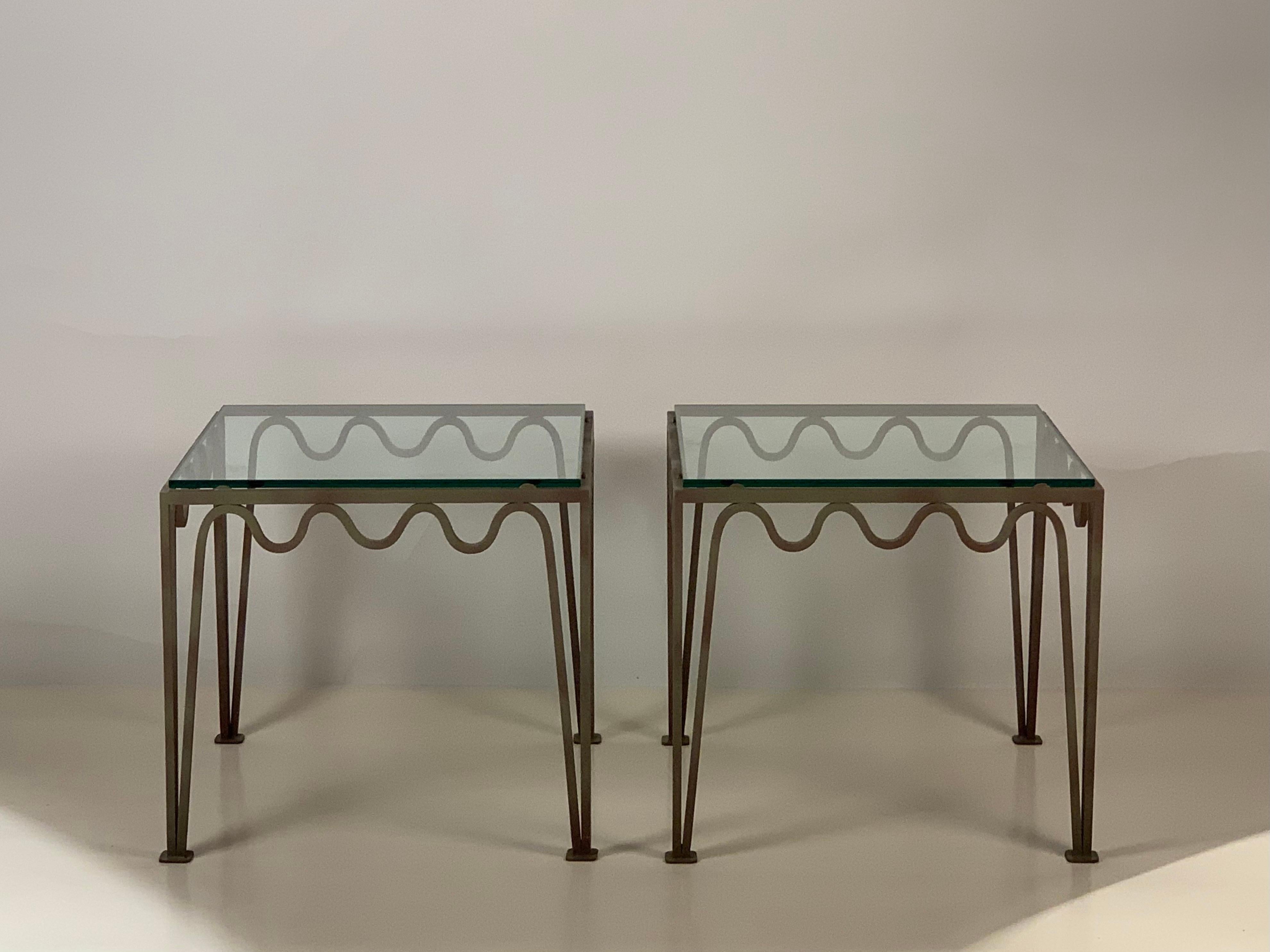 Undulating 'Méandre' verdigris iron and glass side or end tables by DESIGN FRÈRES.

Chic and understated.
