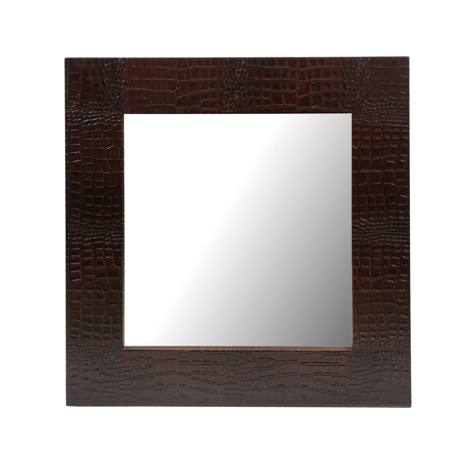 Pair of modern mirrors with beveled glass and dark brown crocodile surrounds. Hung on D-rings. 

Size: 36 x 36

Condition: Good.