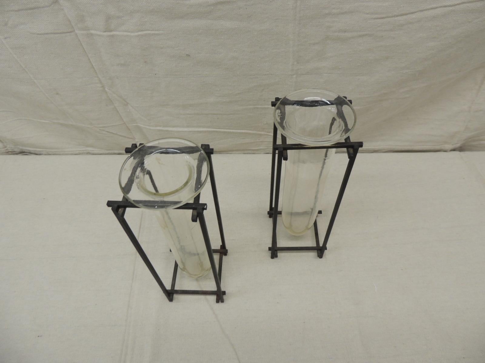 Pair of square modern iron and hand blown glass vases
Measures: 3.5 x 3.5 x 10 H.
