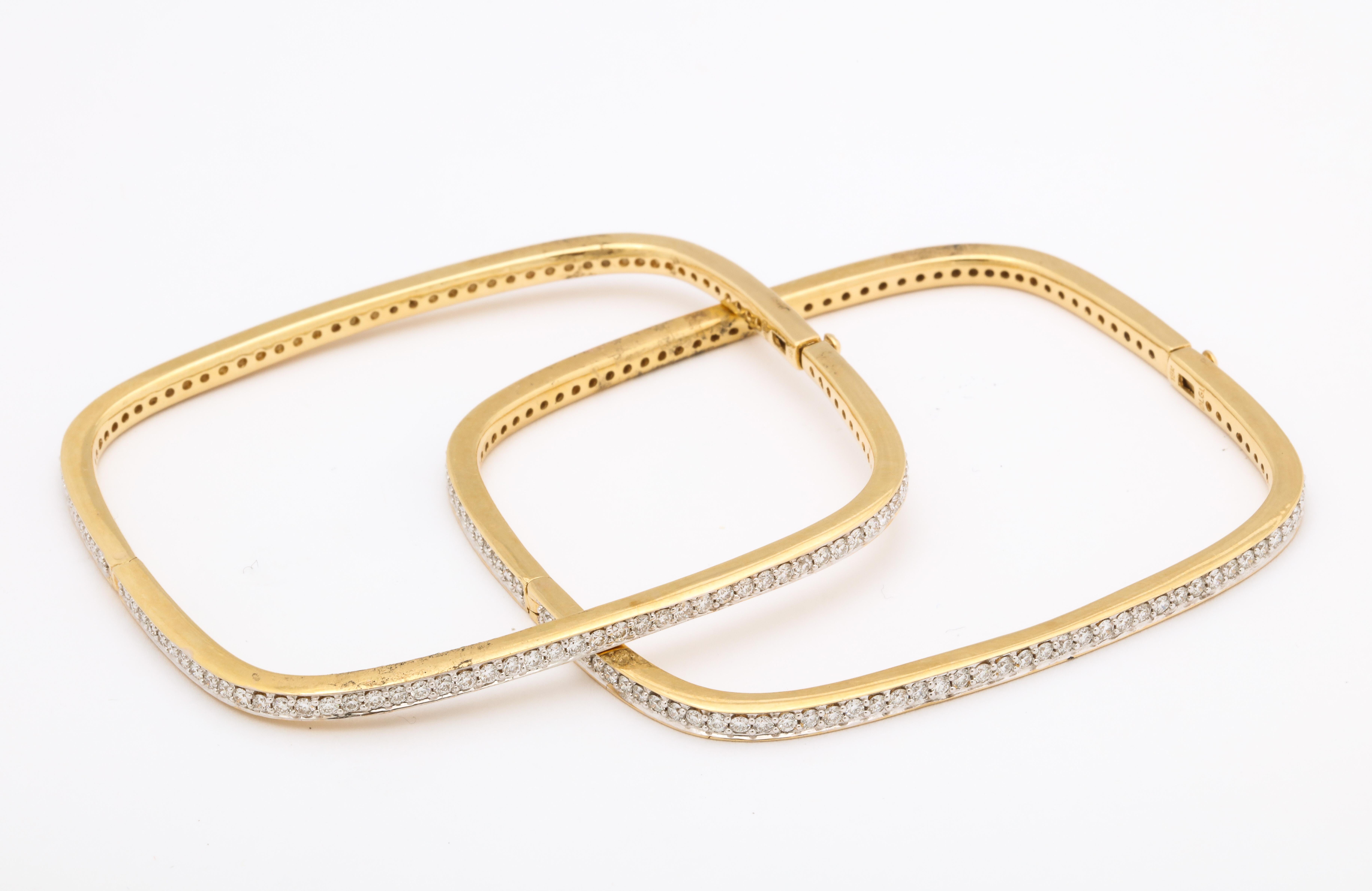 These diamond bangle bracelets are beautifully made with fine quality diamonds on all four sides.

There are approximately 4 1/2carats of fine diamonds VS 1 G set in 18K yellow gold. Because of the shape, they rest on the hand and don’t slide off.
