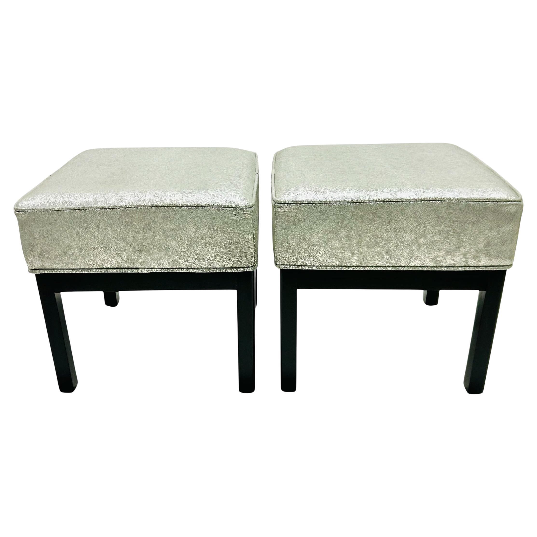 Crafted with elegance and clean lines of the Mid Century Modern aesthetic, this pair of custom made stools in Luxe Shagreen Silver Leather and Walnut stained bases add charming accent for any room. They are meticulously crafted by hand in a