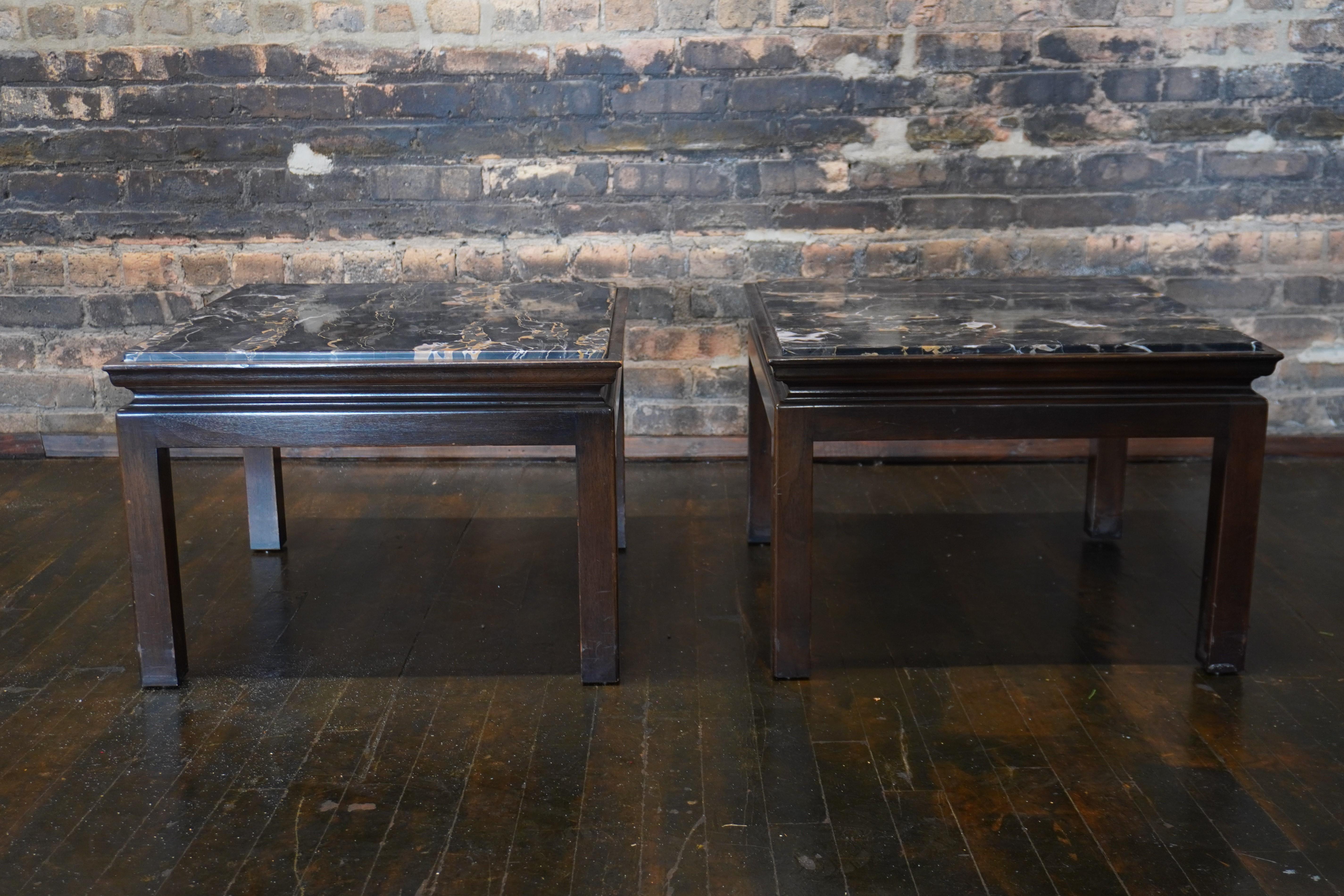 Lovely pair of Widdicomb end tables circa 1960.  They feature a square wood base with an inset piece of gorgeous Nero Portoro marble to serve as the top.  The marble is absolutely stunning.  It has a black field with lovely lush gold and off-white