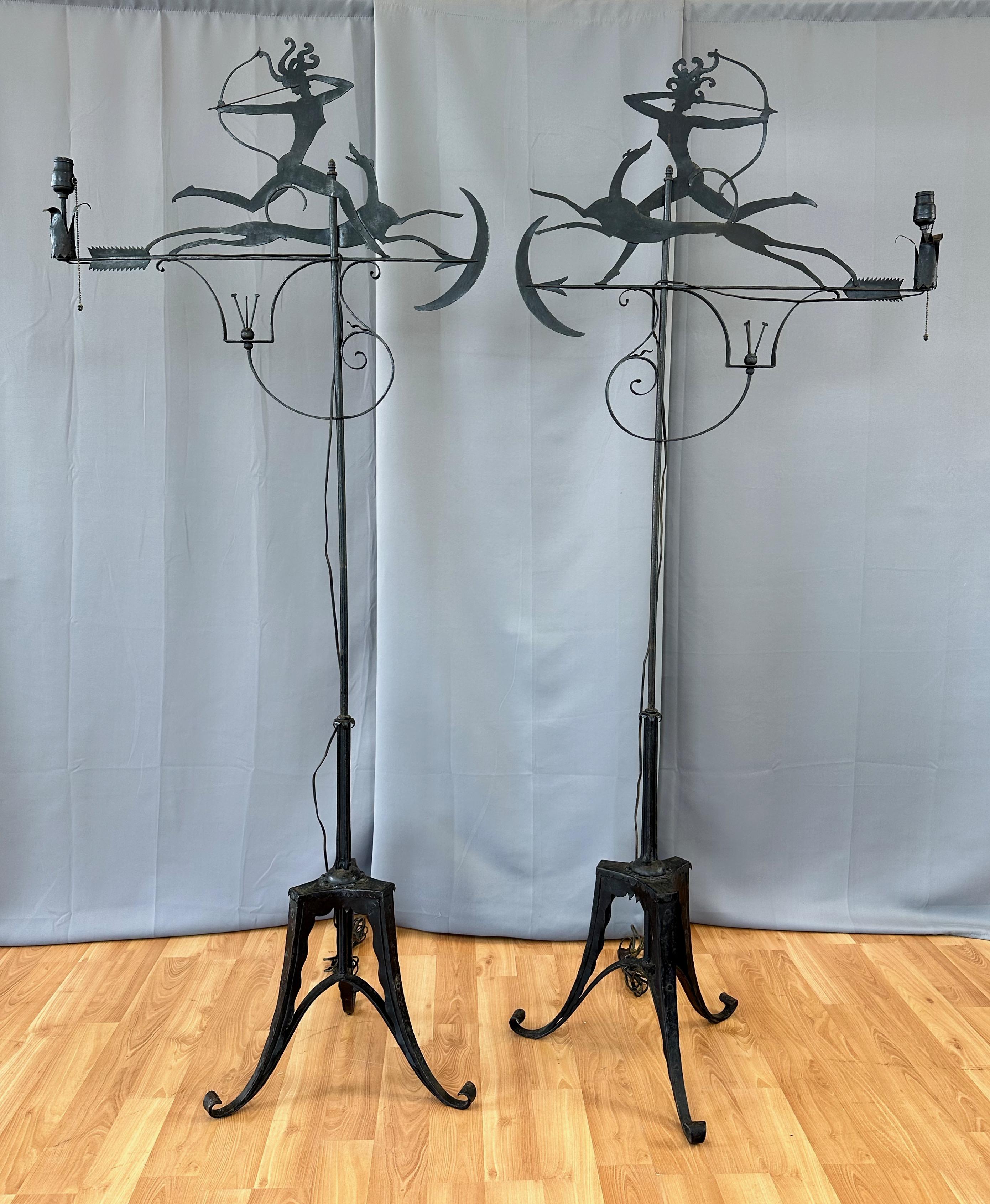 A pair of striking and unique circa 1920 tall Art Deco wrought iron and metal “Diana the Huntress”-themed floor lamps from the famous and prestigious St. Francis Hotel in downtown San Francisco.

Lively cut metal silhouette depicts Diana—storied