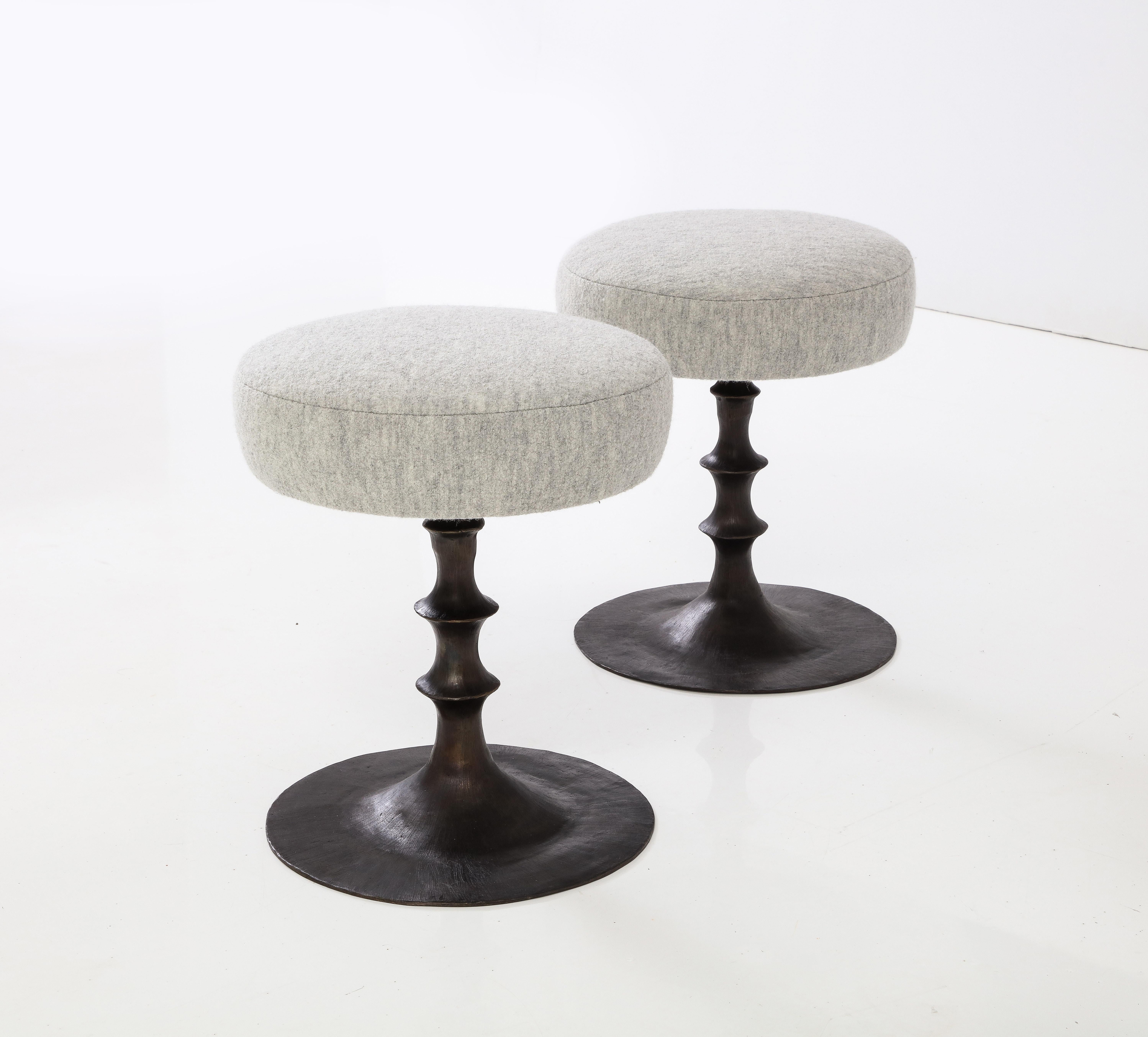 These St Paul stools are an ideal occasional elegant seating option . The organic modern leg is artfully cast in solid bronze . The circular seat cushion completes the outstanding design. This pair has been created with a grey wool cushion. Stools