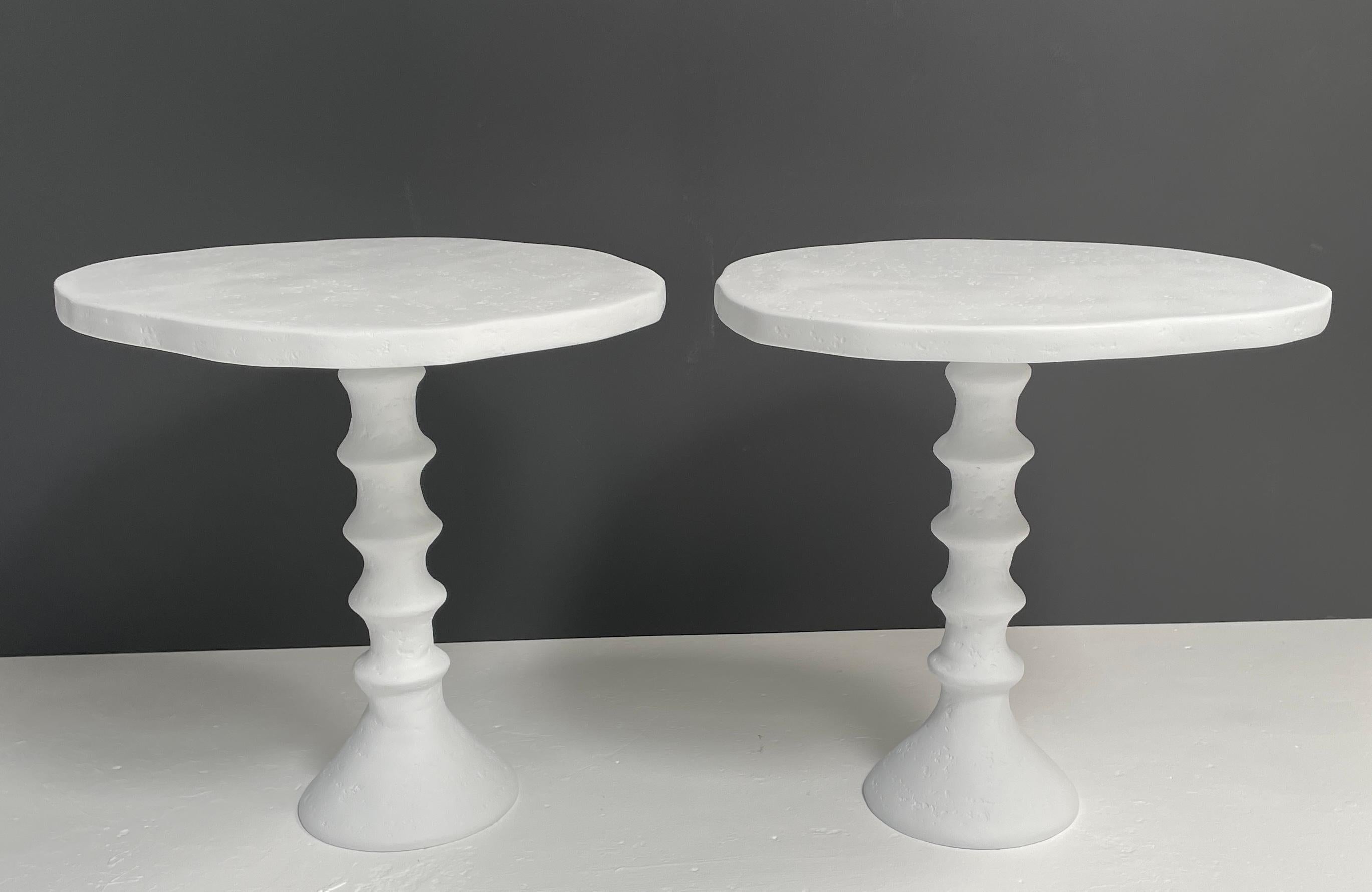 Organic in shape, this plaster side table with its pedestal base is a unique piece and very versatile. This medium scale side table works well in both traditional and modern interiors. The handcrafted plaster is beautiful in its natural white