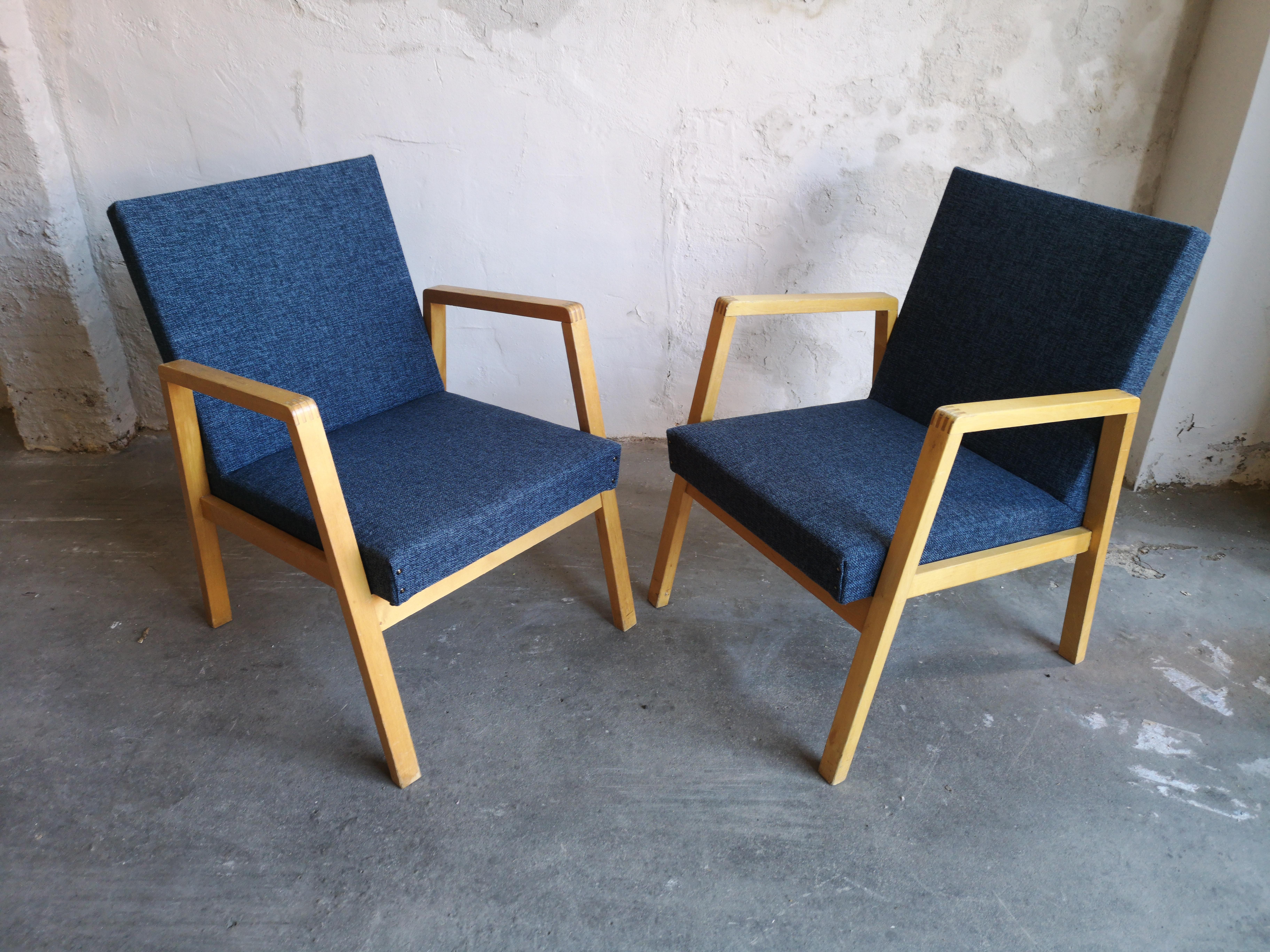 A stunning pair of stackable Alvar Aalto chair 54/404, a padded variant of hallway chair 403 designed in 1932. They are in excellent condition, recently refurbished.