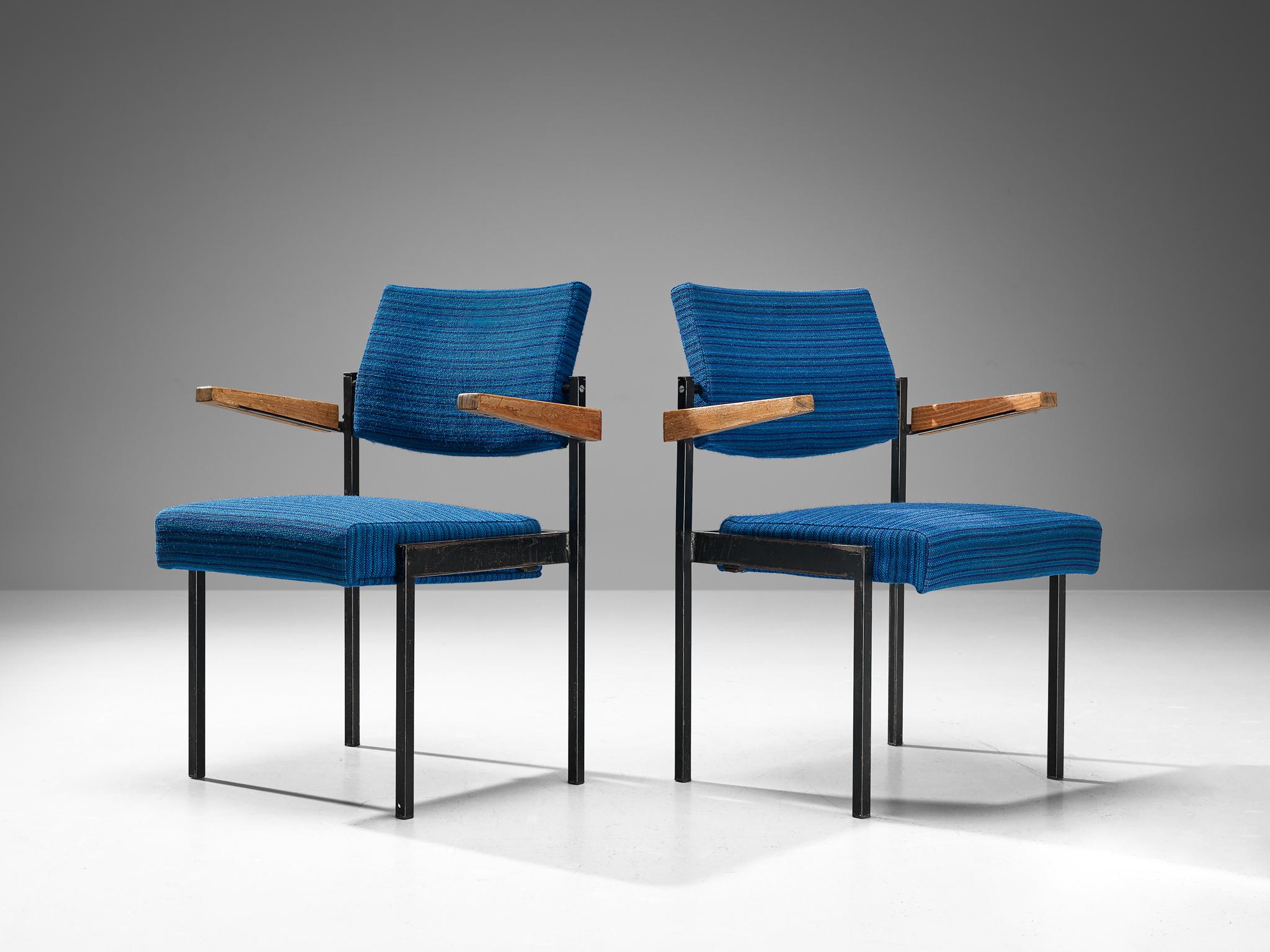 Pair of armchairs, lacquered metal, fabric, beech, The Netherlands, 1960s.

This set of mid-century Dutch chairs are stackable and therefore easy to store. Another functional feature is the possibility to fold the seats. The upholstery is structured
