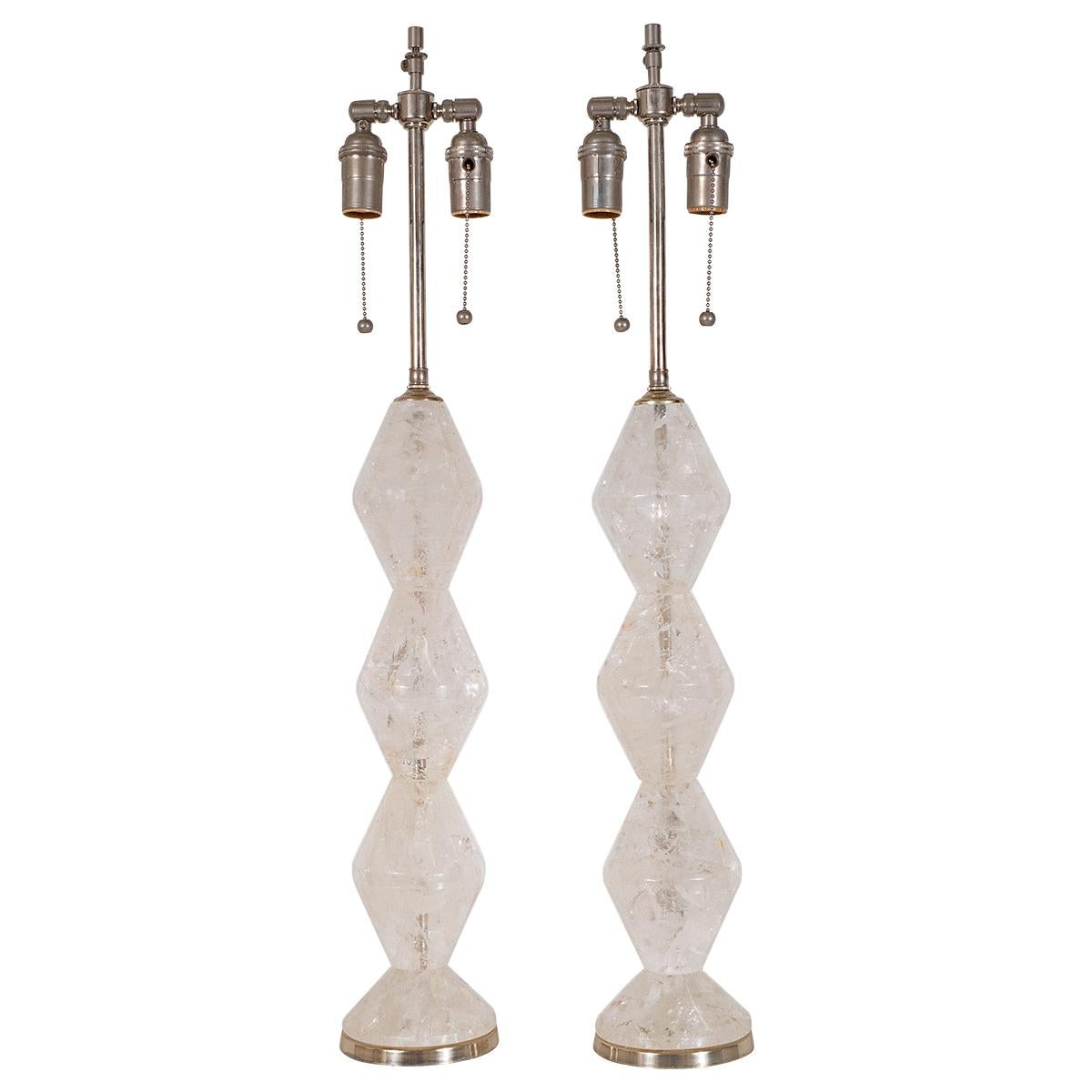 Pair of rock crystal tables lamps with stacked diamond design and nickel hardware.