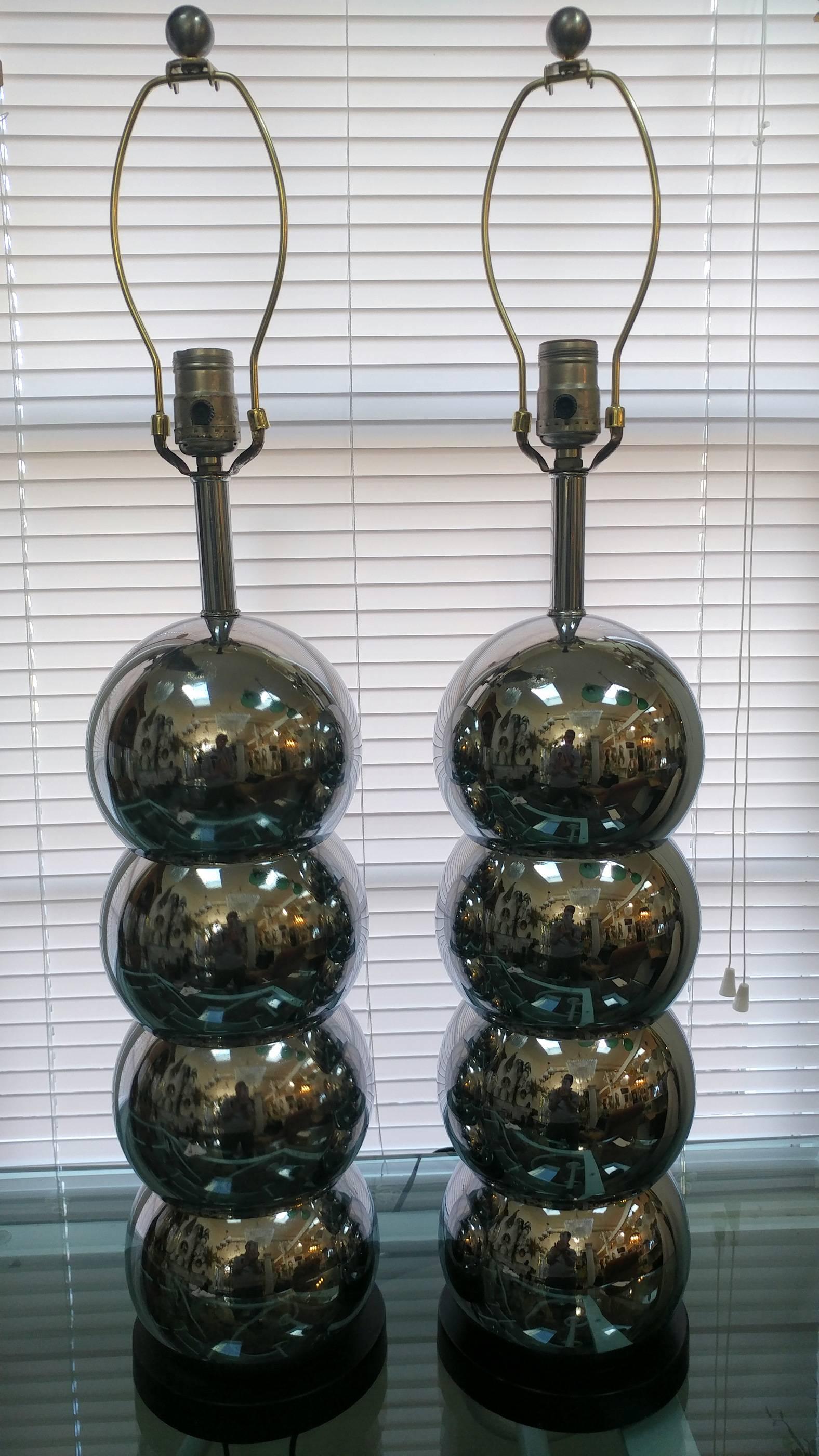 Lovely pair of mirror chrome stacked balls table lamps by George Kovacs, included pair of vintage custom handmade string shades by Hilo Steiner. These lamps are in exceptional vintage condition on black plinth base.