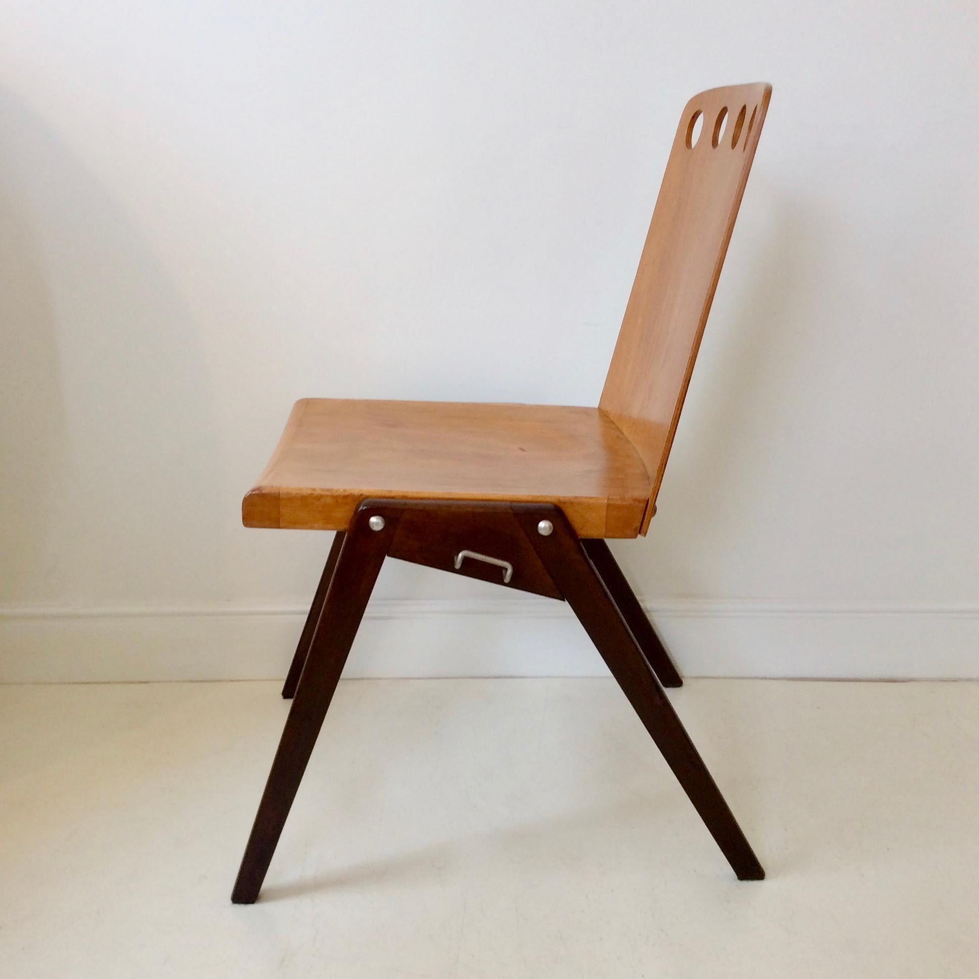 Pair of stacking chairs, circa 1950, Austria, design attributed to Roland Rainer.
Plywood and brown tinted wood.
Dimensions: 82 cm H, 56 cm D, 52 cm W, seat height: 46 cm.
Original condition, beautiful patina of use.
3 set available.

 