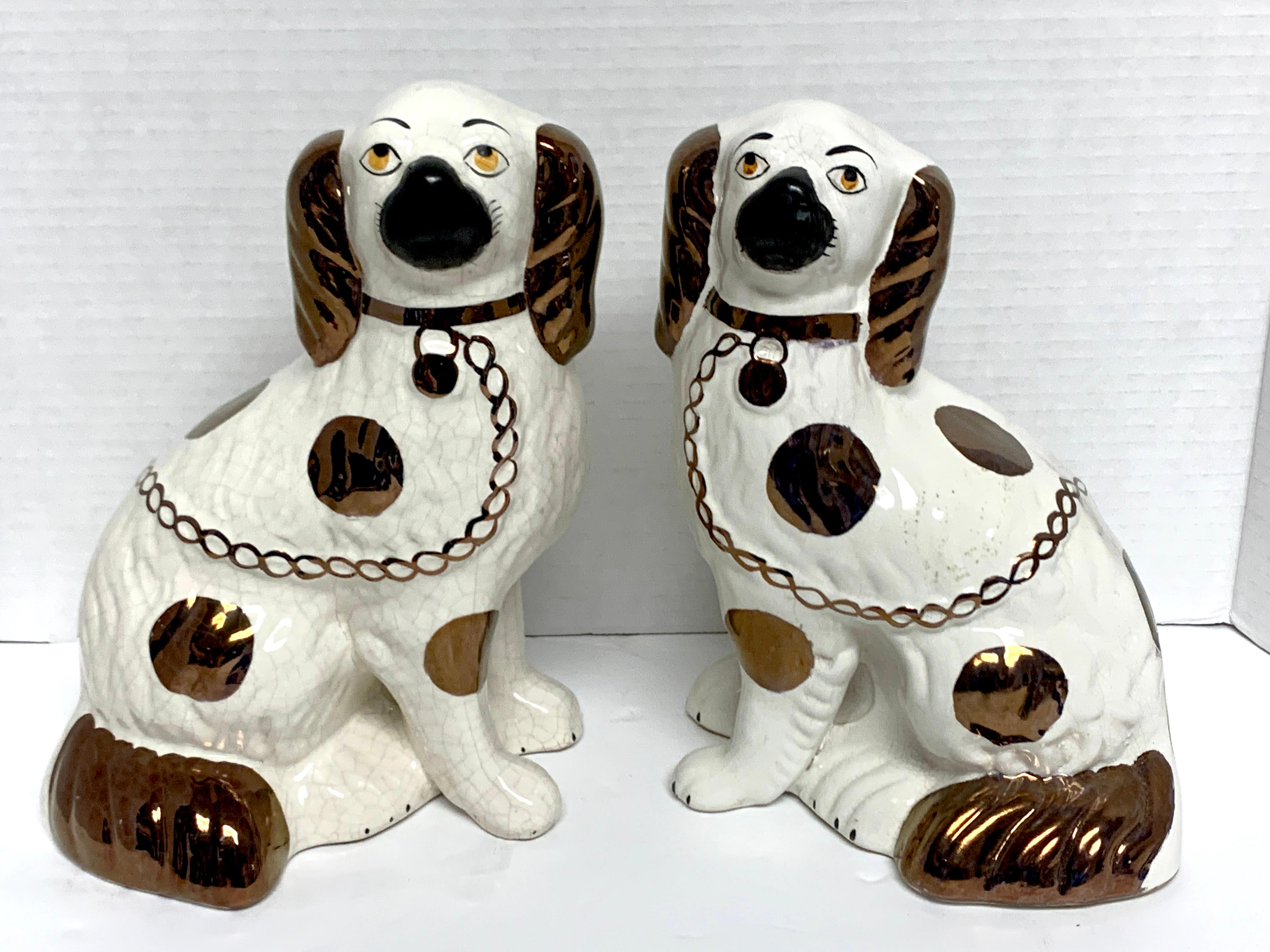 Pair of Staffordshire copper luster dogs with separated legs, wider.