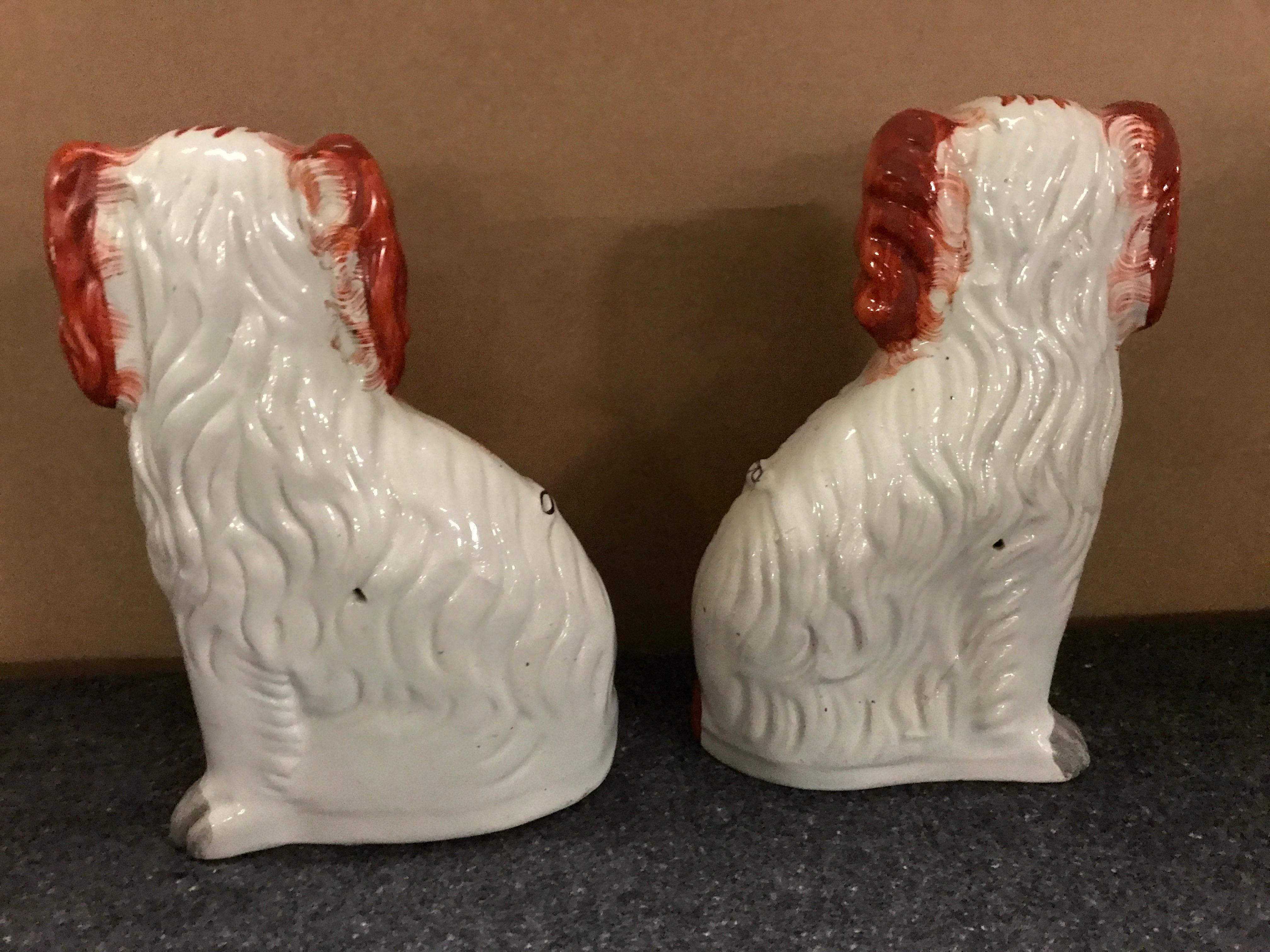 High Victorian Pair of Staffordshire England Red Seated Spaniel Dogs For Sale