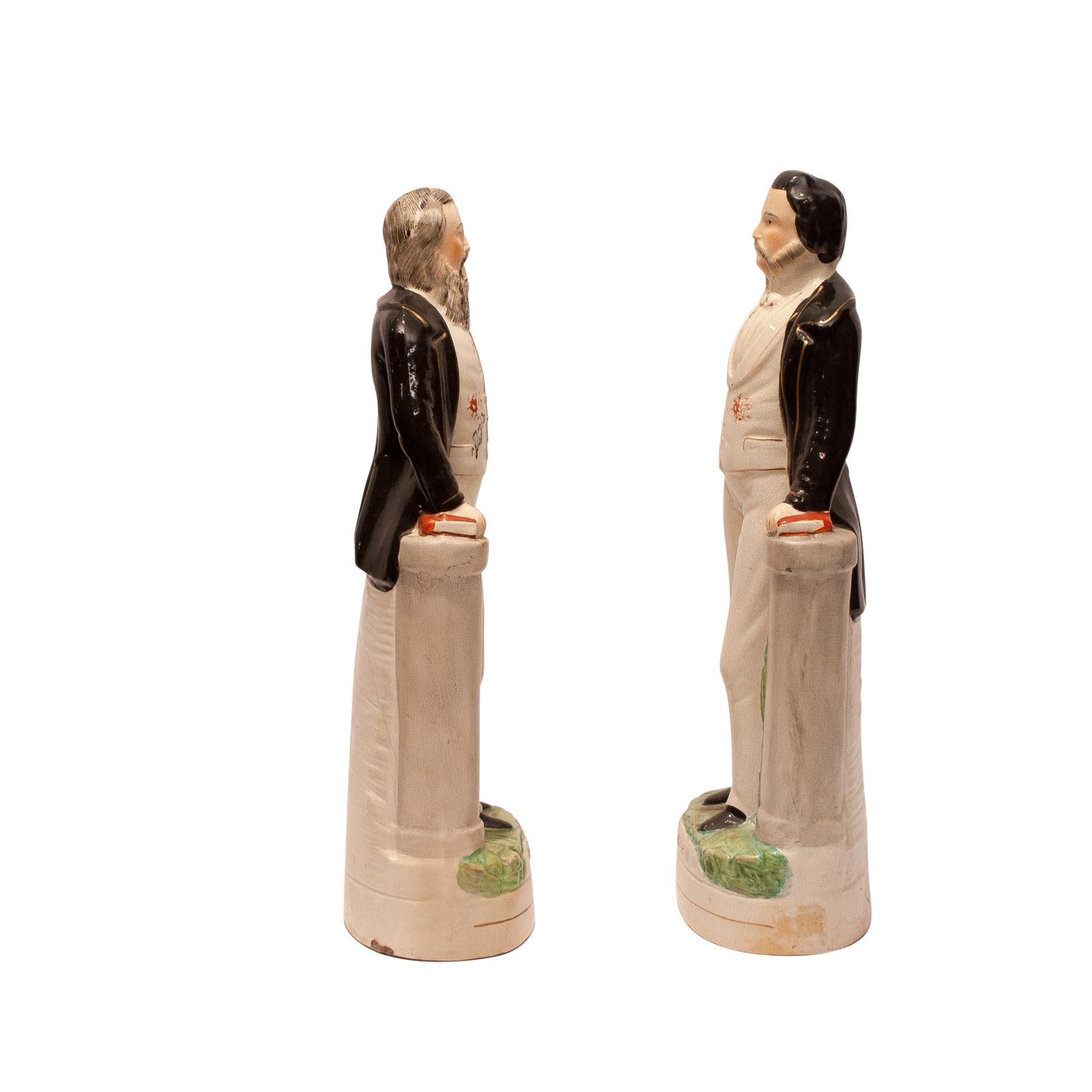 A pair of large English Staffordshire figures of Moody and Sankey, circa 1860. The measurements are for Moody, Sankey measures 16.75