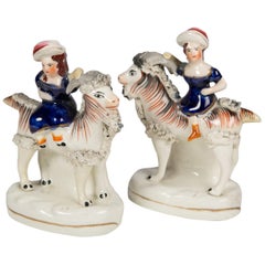 Pair Staffordshire Figures of Children Riding Goats circa 1880