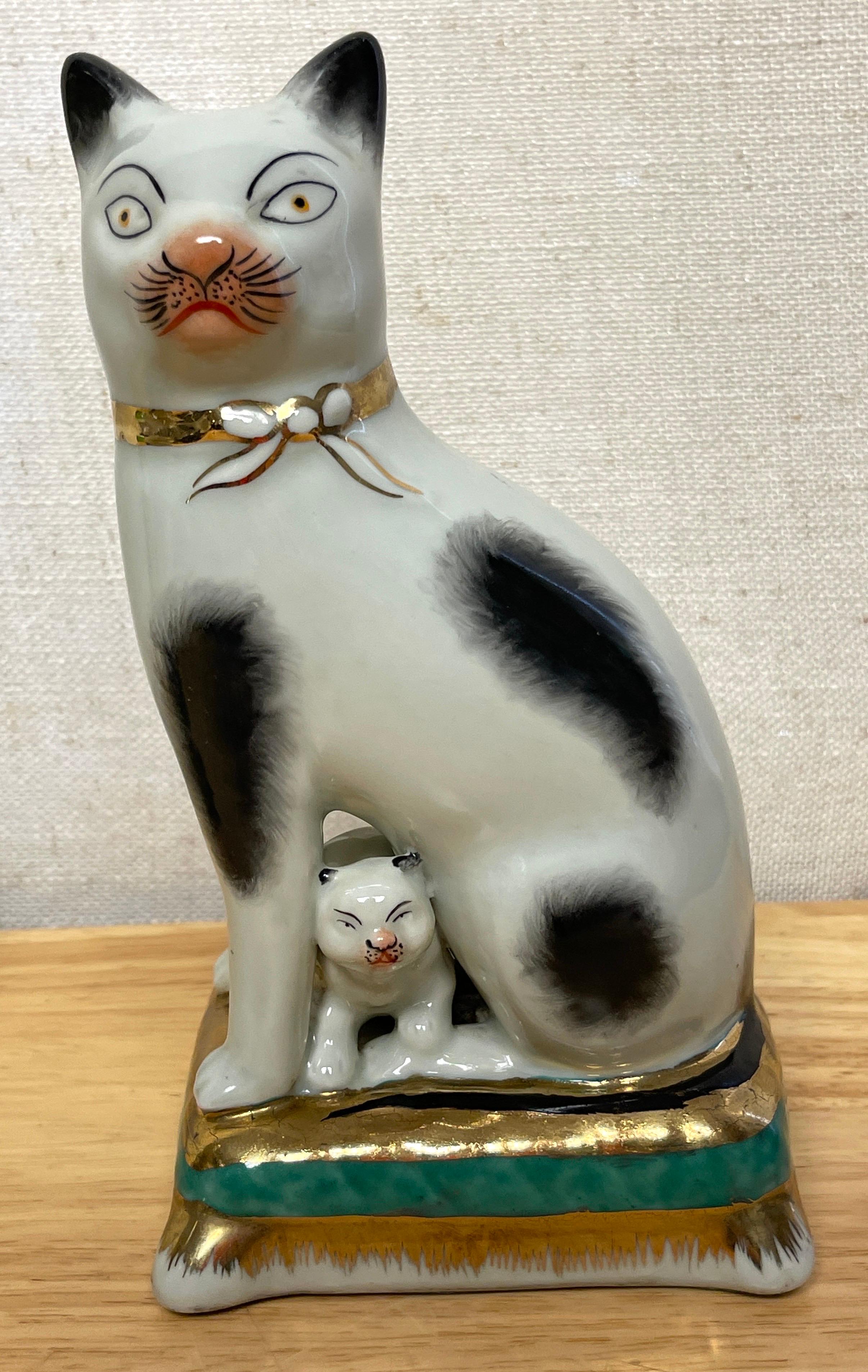 20th Century Pair of Staffordshire Figures of Seated Black & White Cats with Kittens