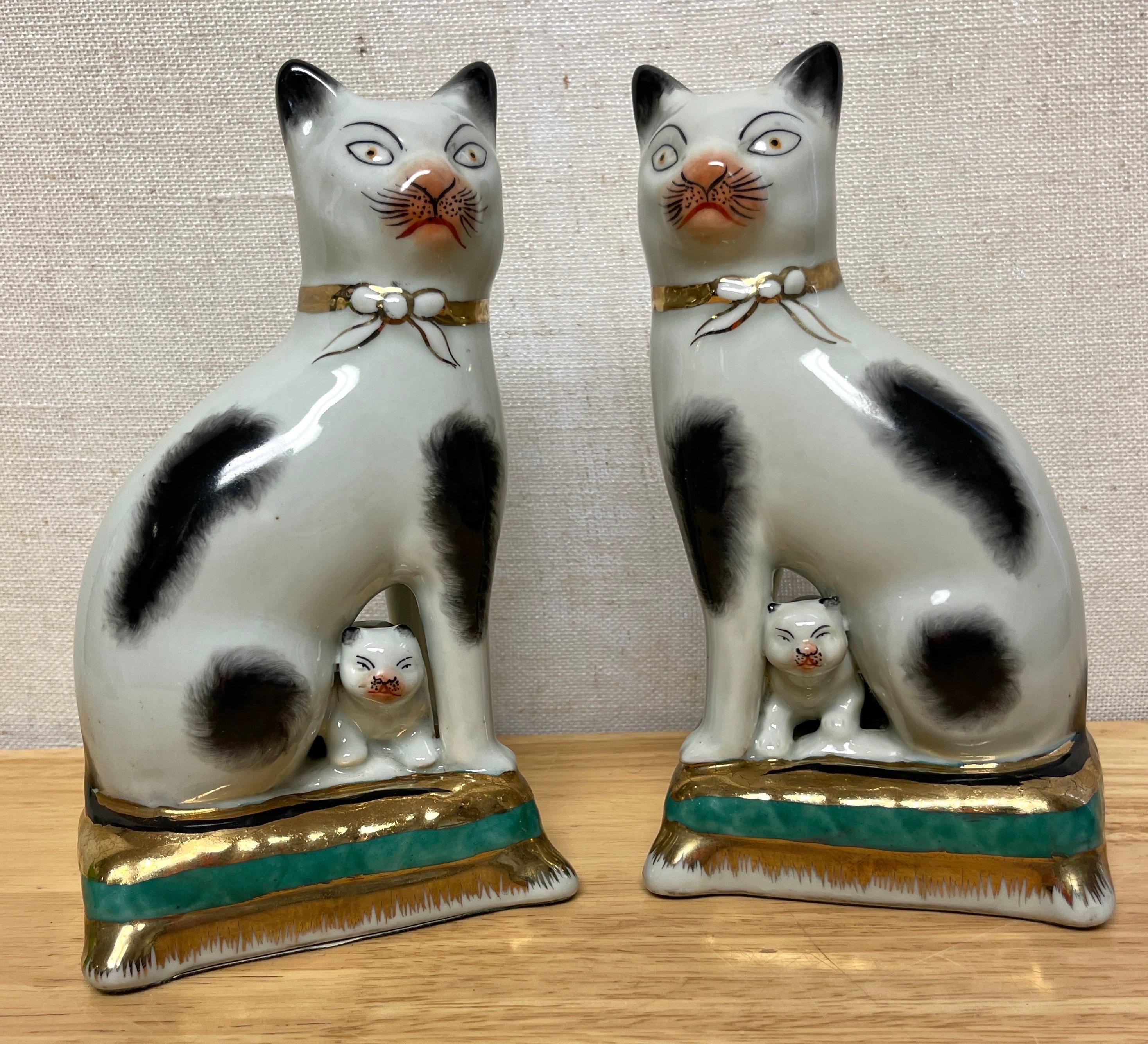 Pottery Pair of Staffordshire Figures of Seated Black & White Cats with Kittens