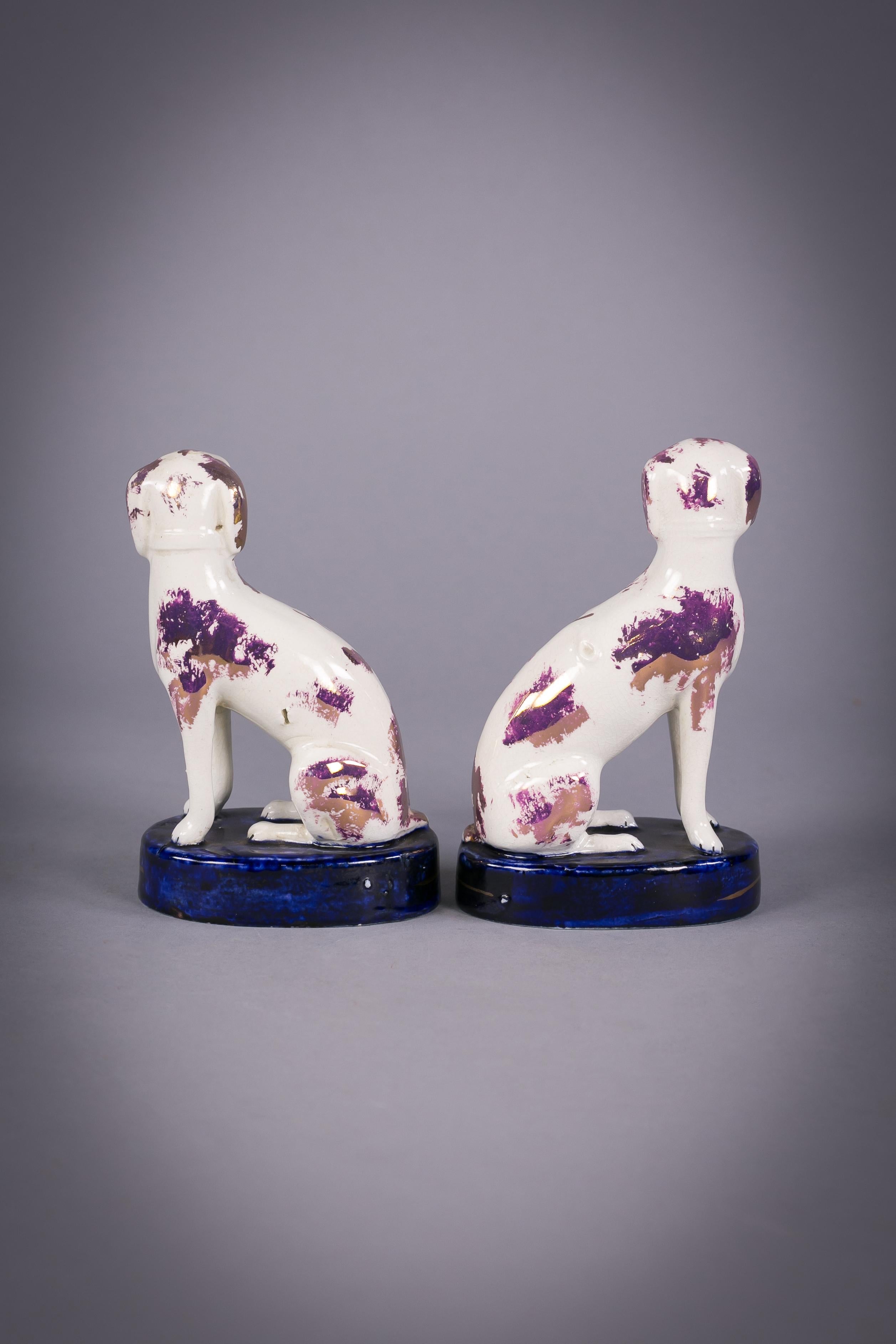 Pair of Staffordshire lustred poodle groups, circa 1860.