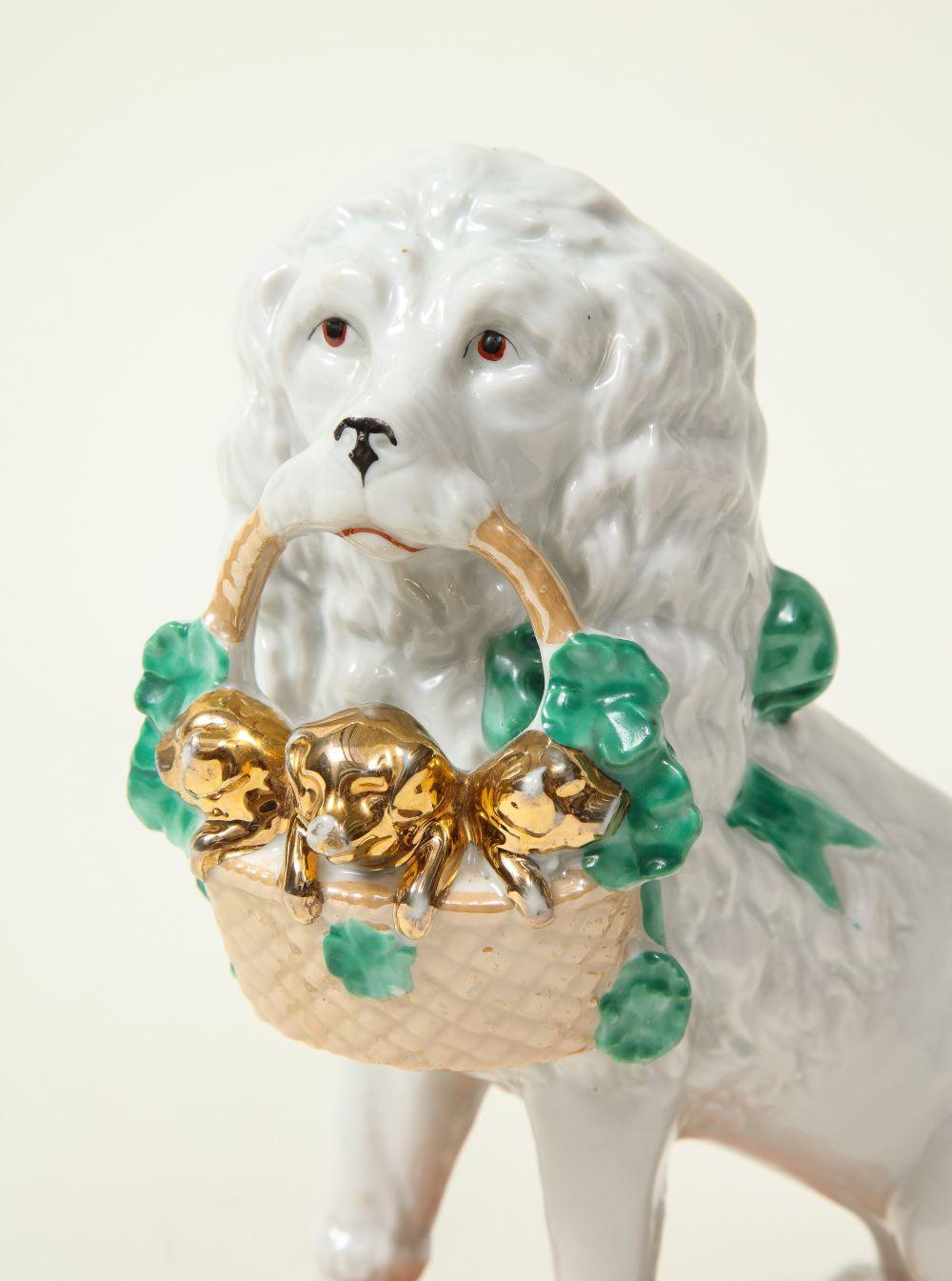 Pair of Staffordshire Porcelain Dogs with Gilt Basket of Pups In Excellent Condition For Sale In New York, NY