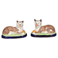 Pair Of Staffordshire Pottery Reclining Cats