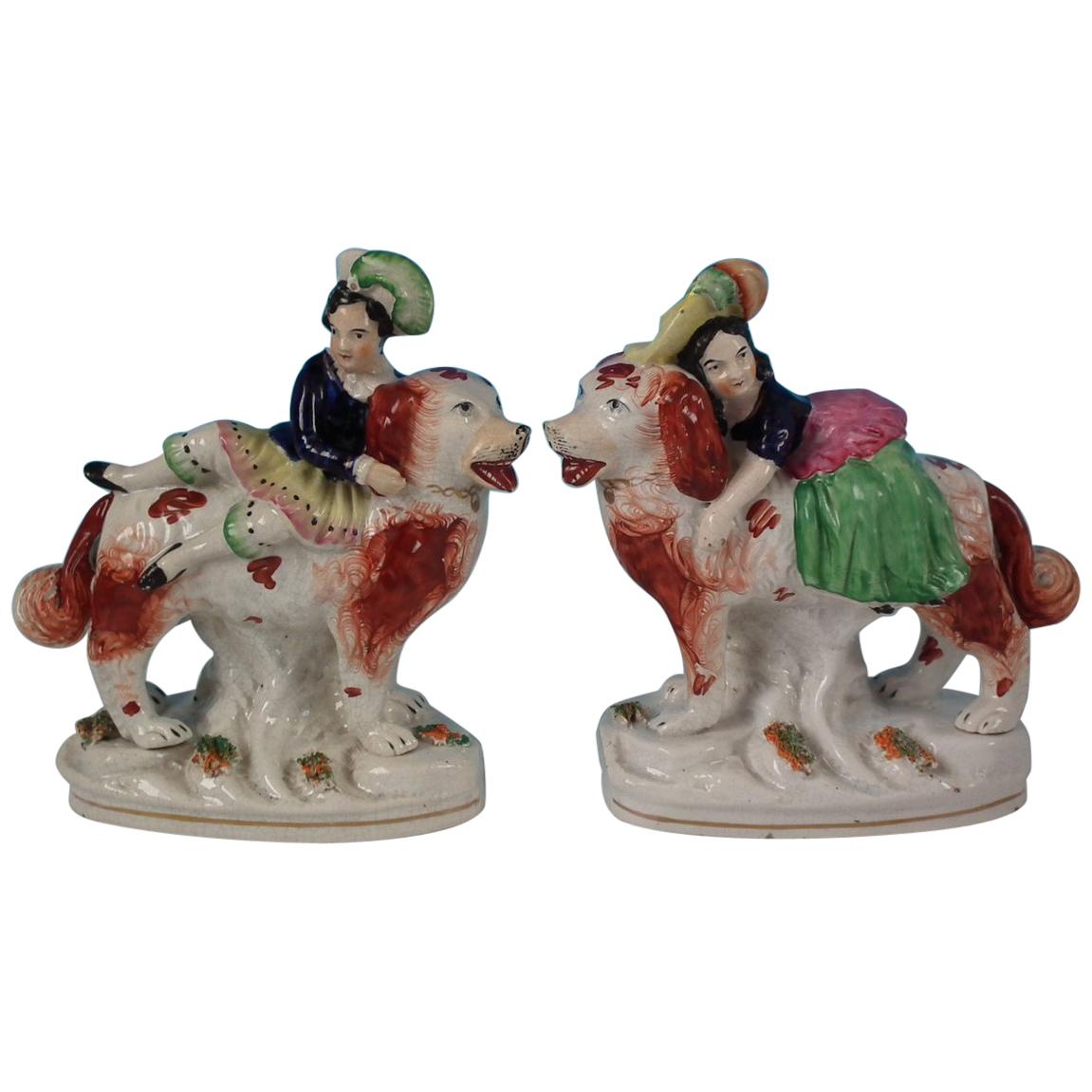 Pair of Staffordshire Royal Children on Spaniels
