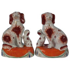 Pair of Staffordshire Spaniels with Pups on Cushions