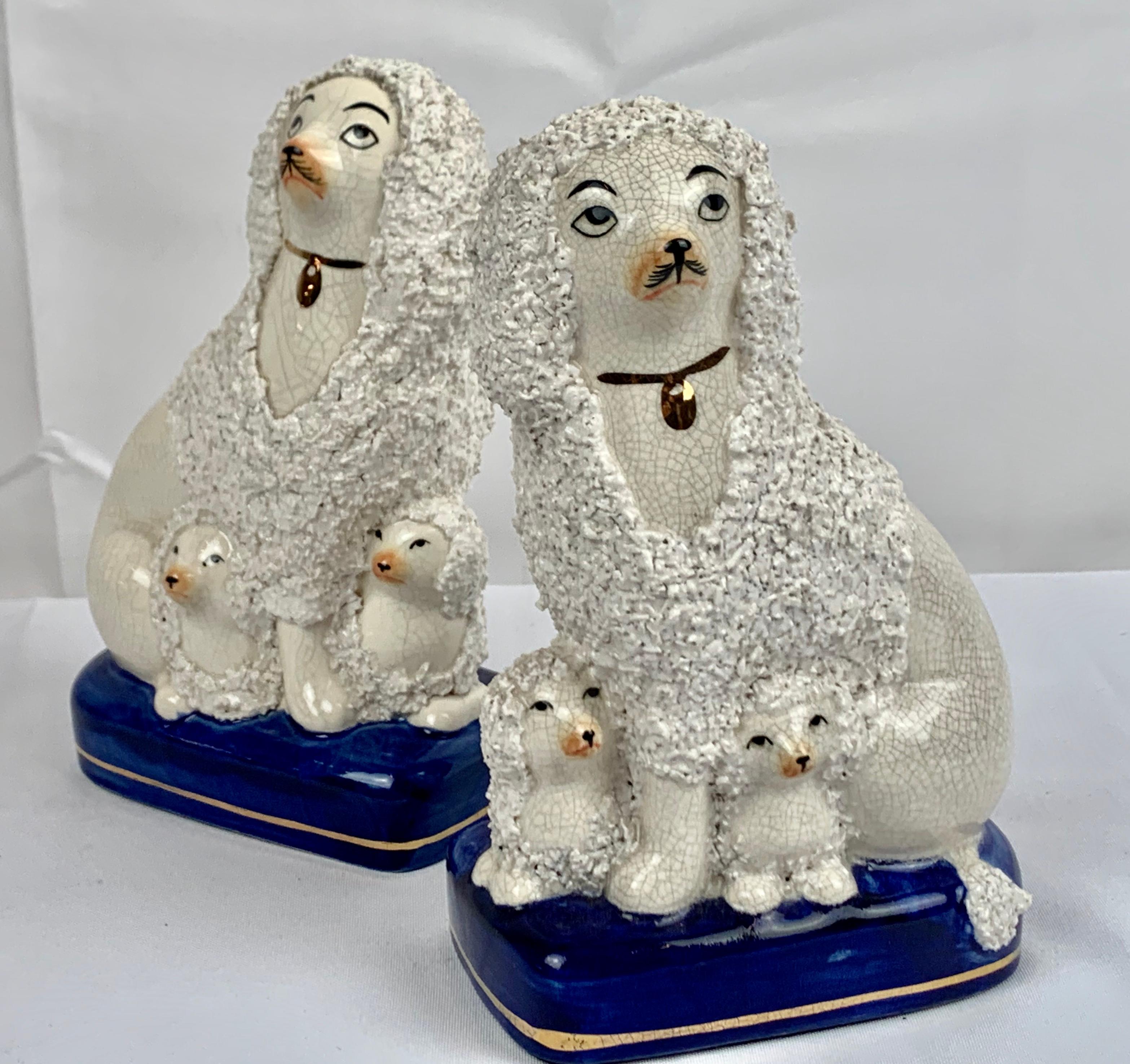 Ceramic Pair of Staffordshire White Poodles on Cobalt Blue Bases