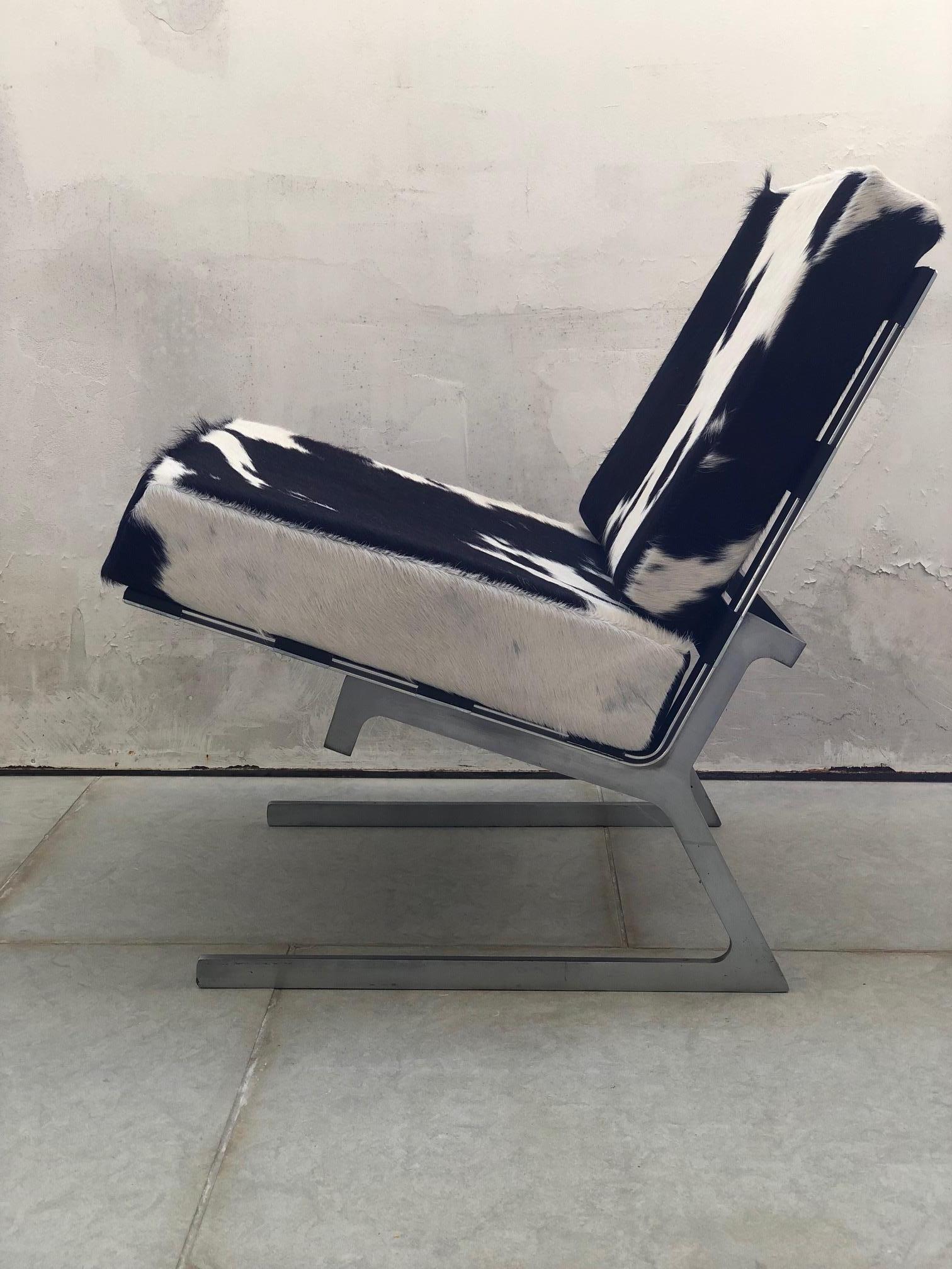 Mid-Century Modern Pair of Stainless Steel and Cowhide Lounge Chairs