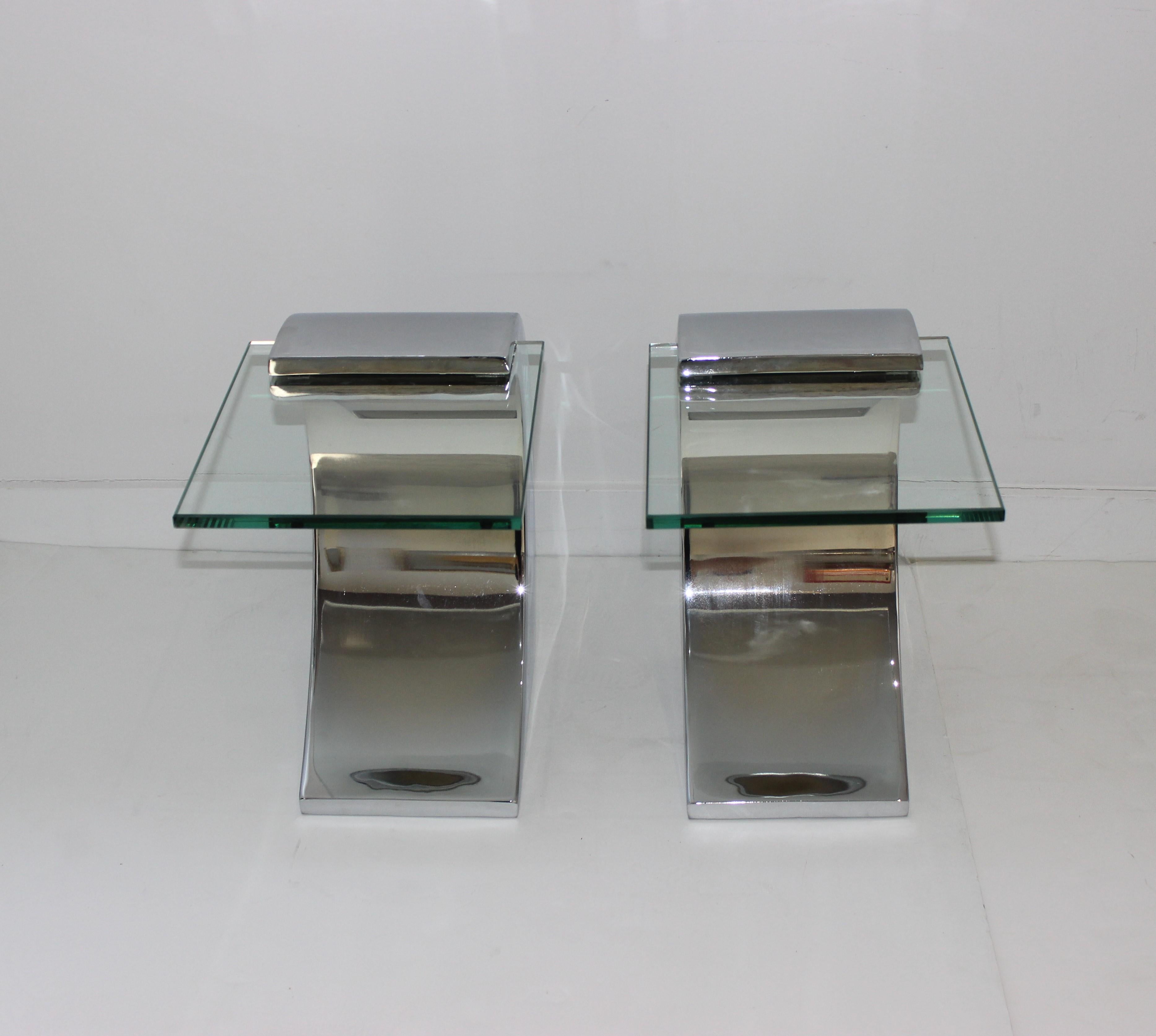 This stylish set of cantilevered side tables are fabricated in stainless steel and glass and were acquired from a South Beach, Miami estate.

Note: Glass is 10 inches wide x 12