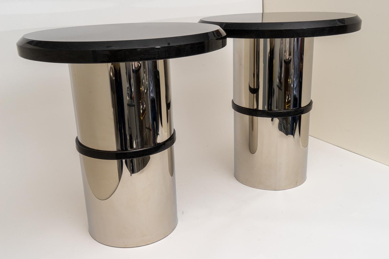 This stylish pair of stainless steel and polished black granite side tables date to the 1980s-1990s and were acquired from a South Beach, Miami estate. 

Note: The black granite top is removable.

Note: The band in the base is also polished