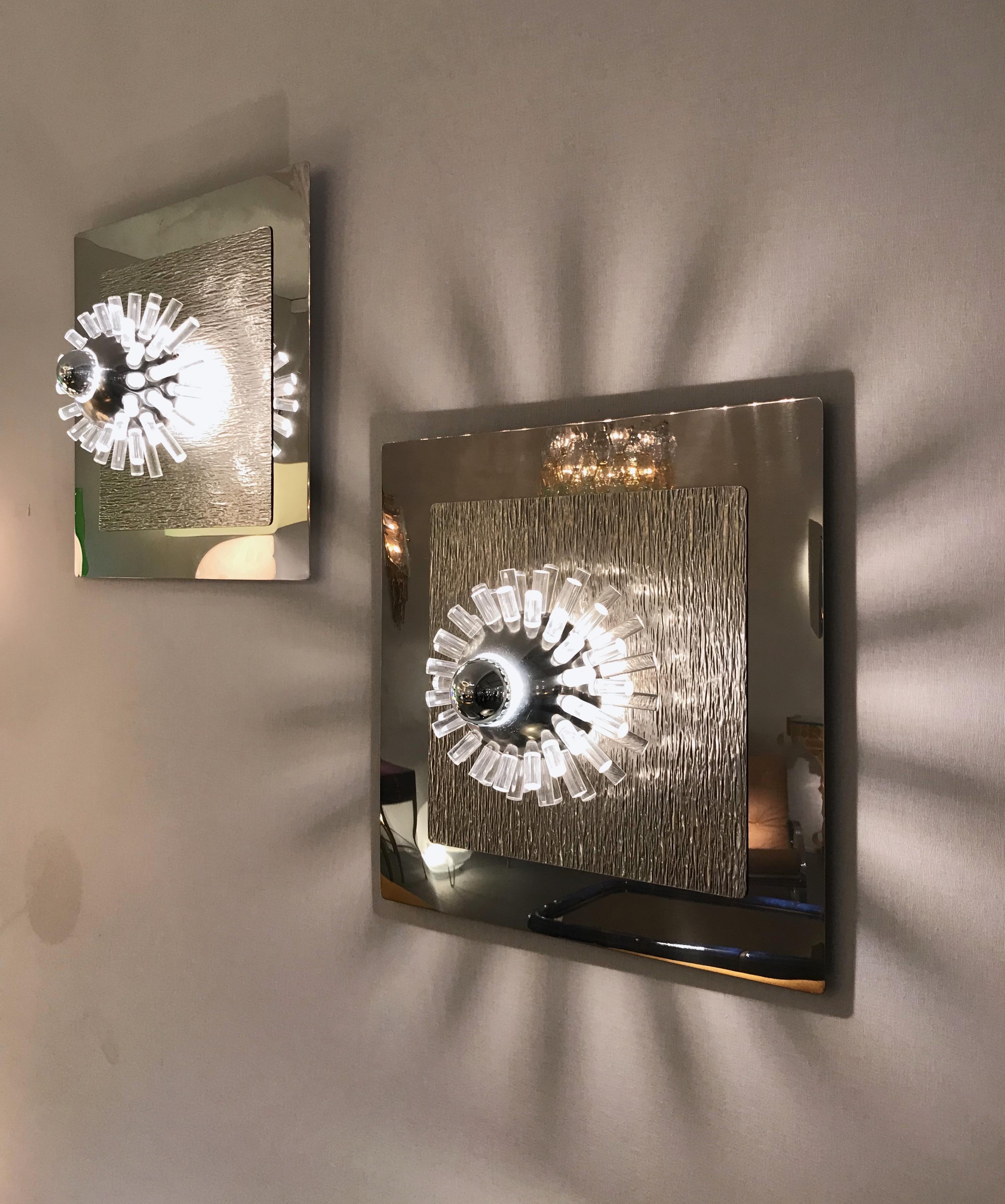 Rare large pair of wall lights sconces panel in polished and hammered stainless steel with metal ball and Lucite rods that diffuses light by the designer Angelo Brotto for the manufacture Esperia. A really Space Age work, famous design like