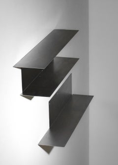 Pair of stainless steel wall-mounted bookshelves from the 1970s