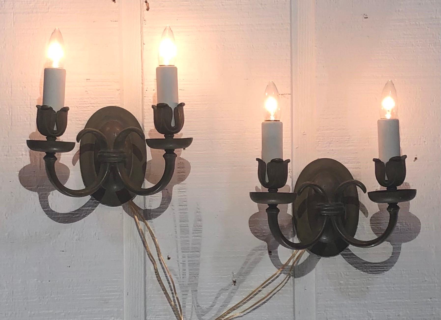 This pair of Caldwell Baroque Style Bronze Sconces are stamped on the backplate. The pair of Stamped Caldwell Baroque Style Bronze Sconces where made in New York in the early Twentieth Century.  The Caldwell Sconces still retains the original