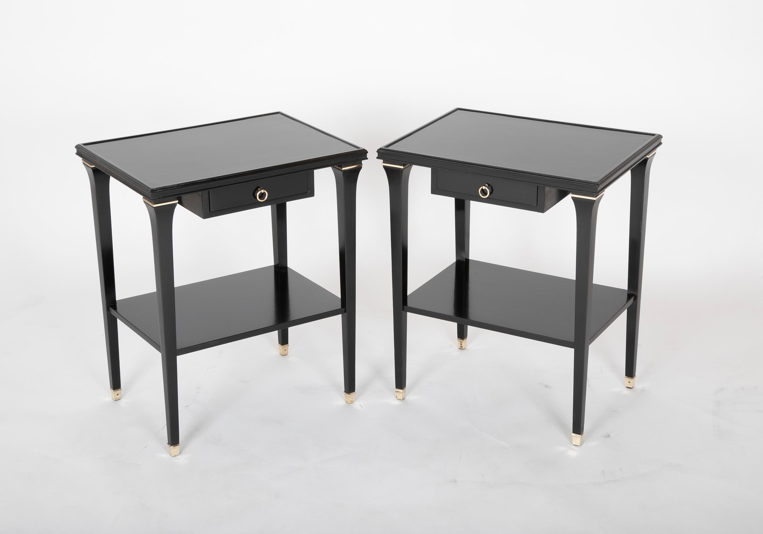 Pair of ebonized oak side tables by stamped Jansen. Finished on four sides.