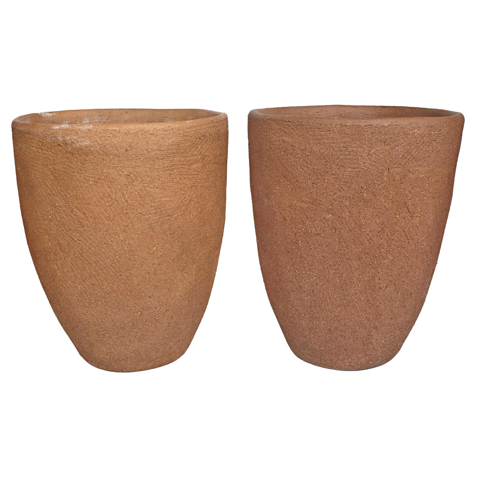 Pair of Stan Bitters scrape pots for Han Sump pf Company. Great vintage condition. Wonderful addition to any interior or patio. 3 holes have been drilled in bottom of pots but have been sealed. Inscribed inside both pots.