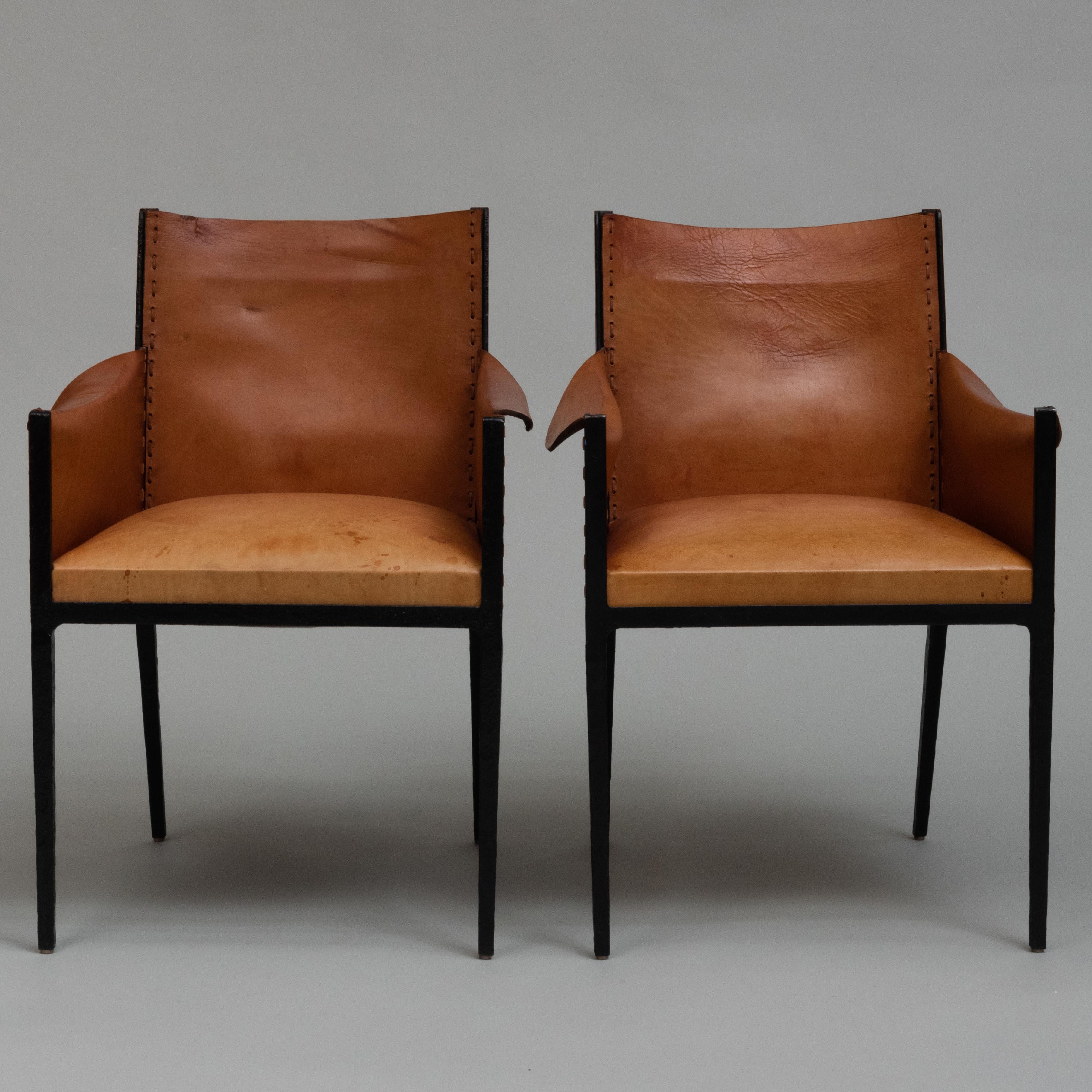 Pair of steel and leather armchairs after Jean Michel Frank. 
Property from the Collection of Mary Wells Lawrence.
Provenance:Mongiardo Studio, Inc., Great Barrington, MA, April 20, 2004.