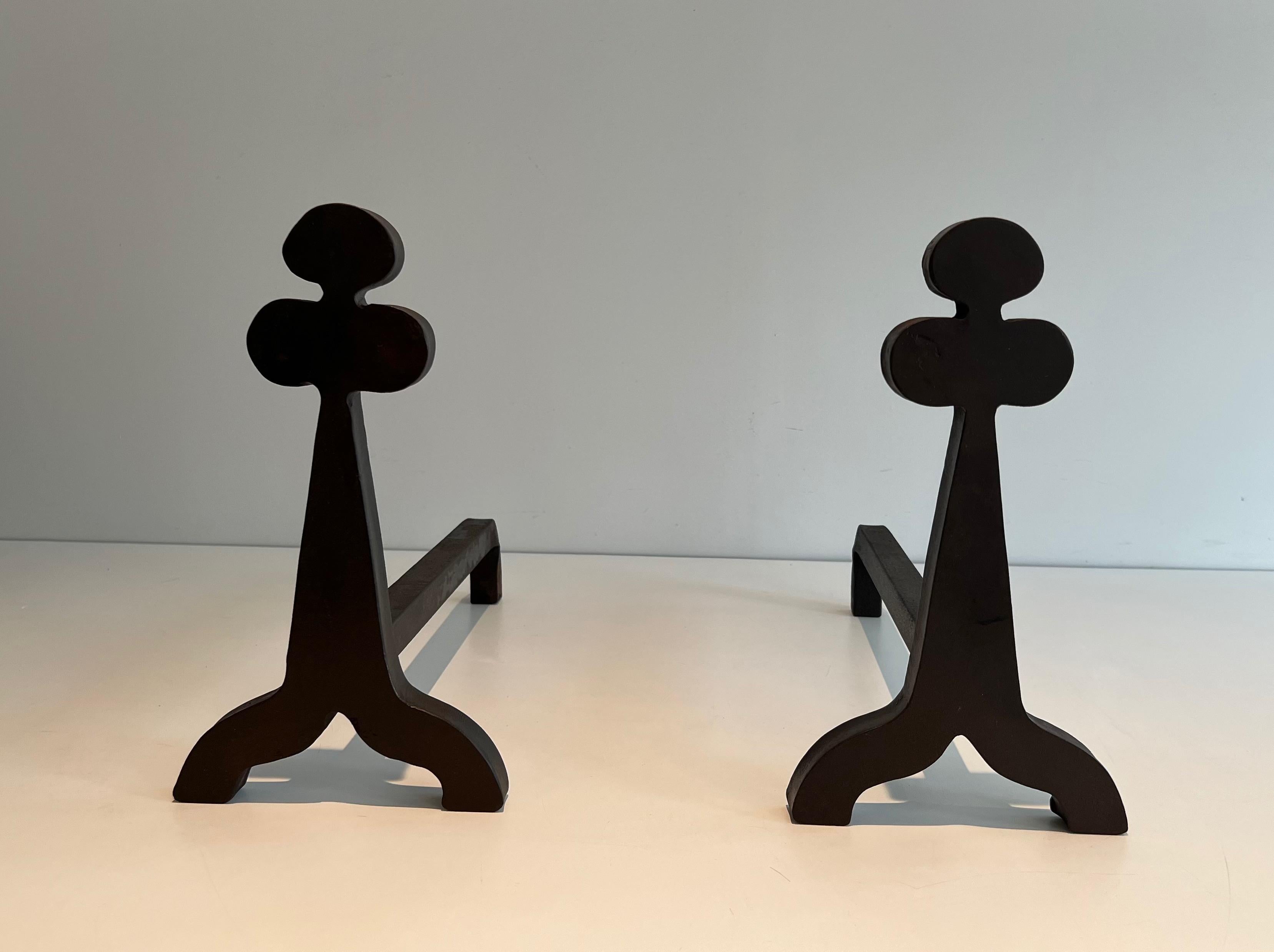 This very nice and unusual design pair of andirons is made of steel and wrought iron ornated with clovers on top. This is a French work. Circa 1950