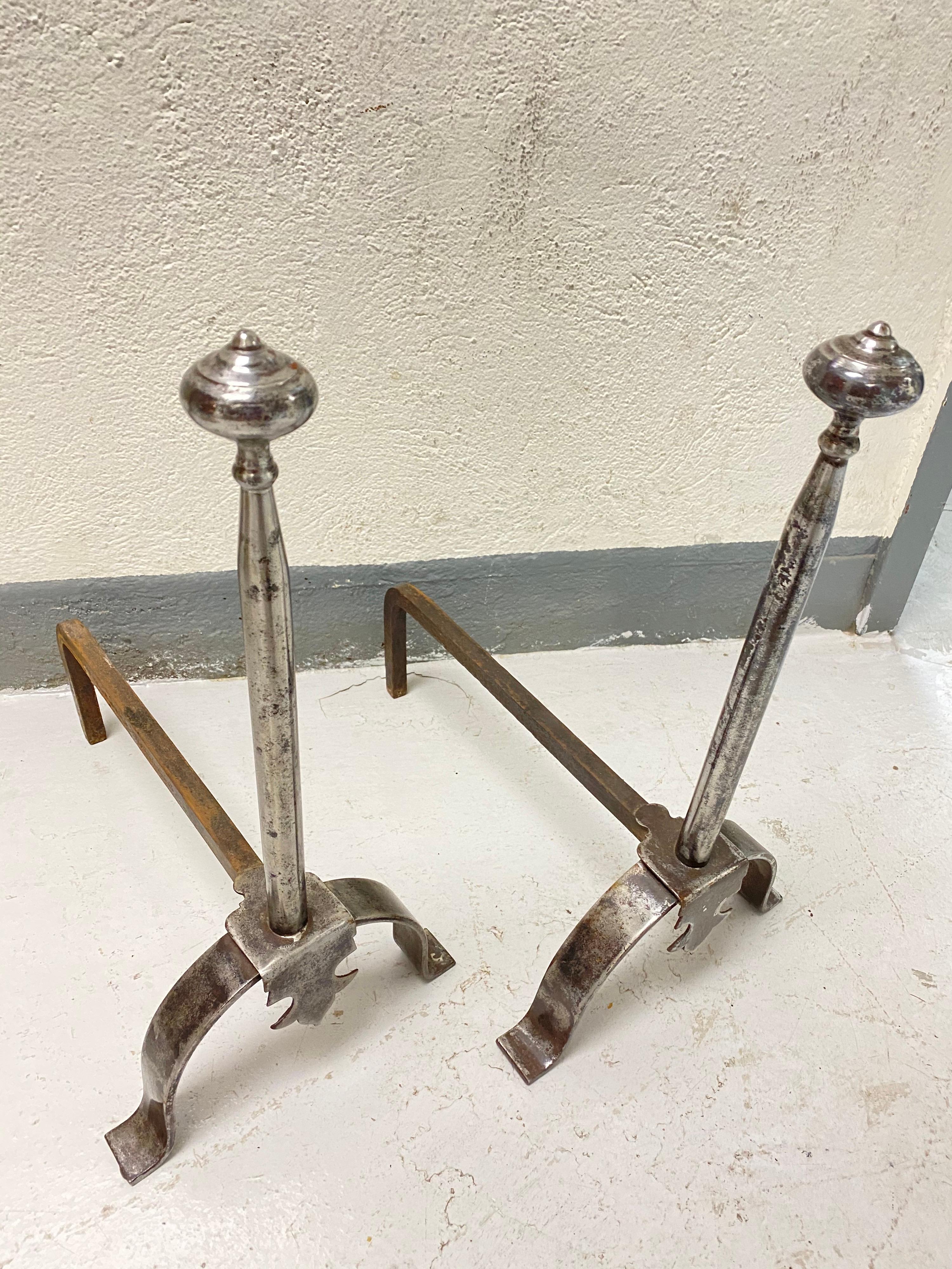 A pair of late 19th century steel andirons

Steel surfaces patinated and polished to a good even finish.