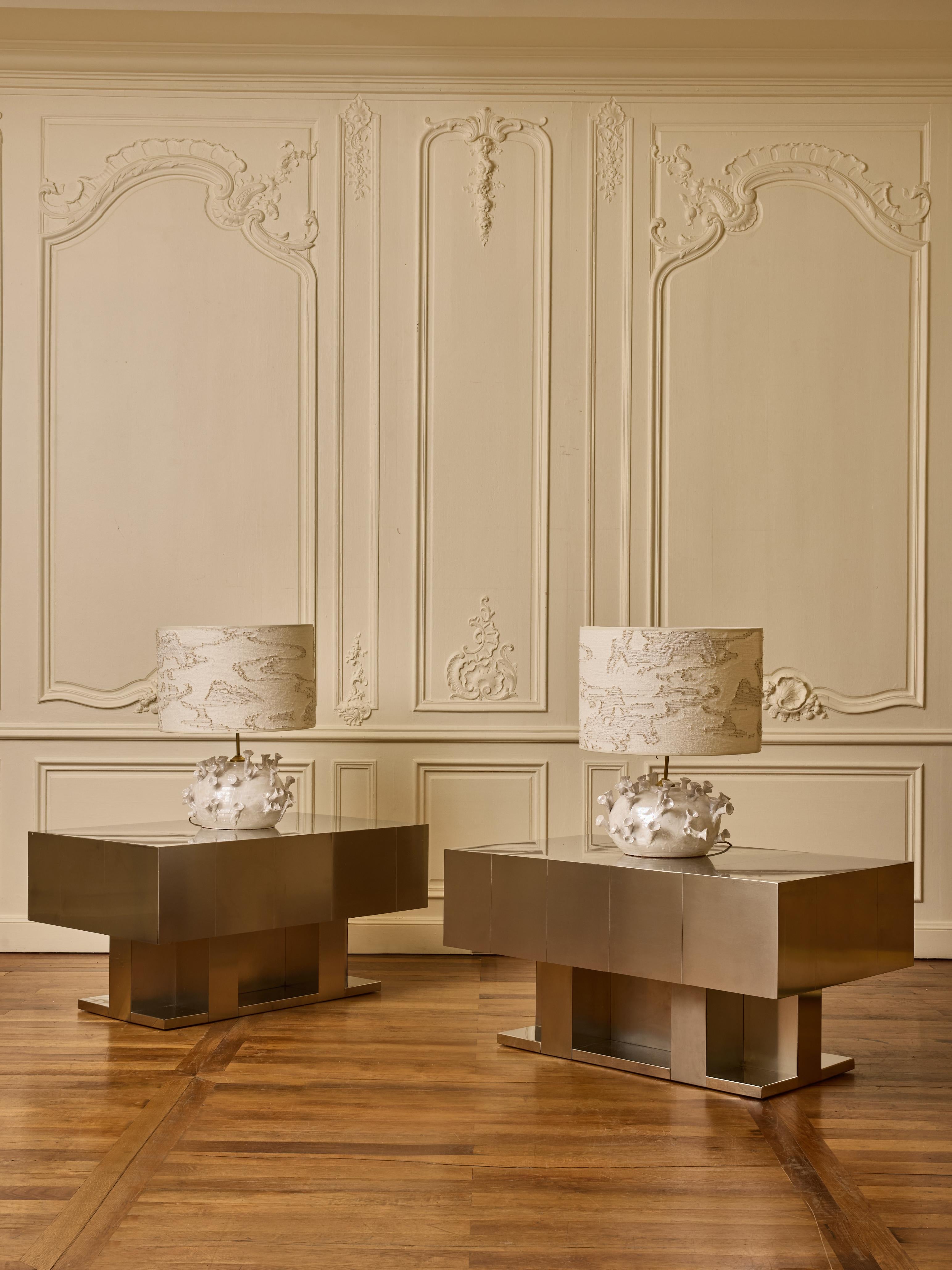 Superb pair of coffee table in brush steel. 
Ask for availability. 

Price for the pair but can be sold individually. 
