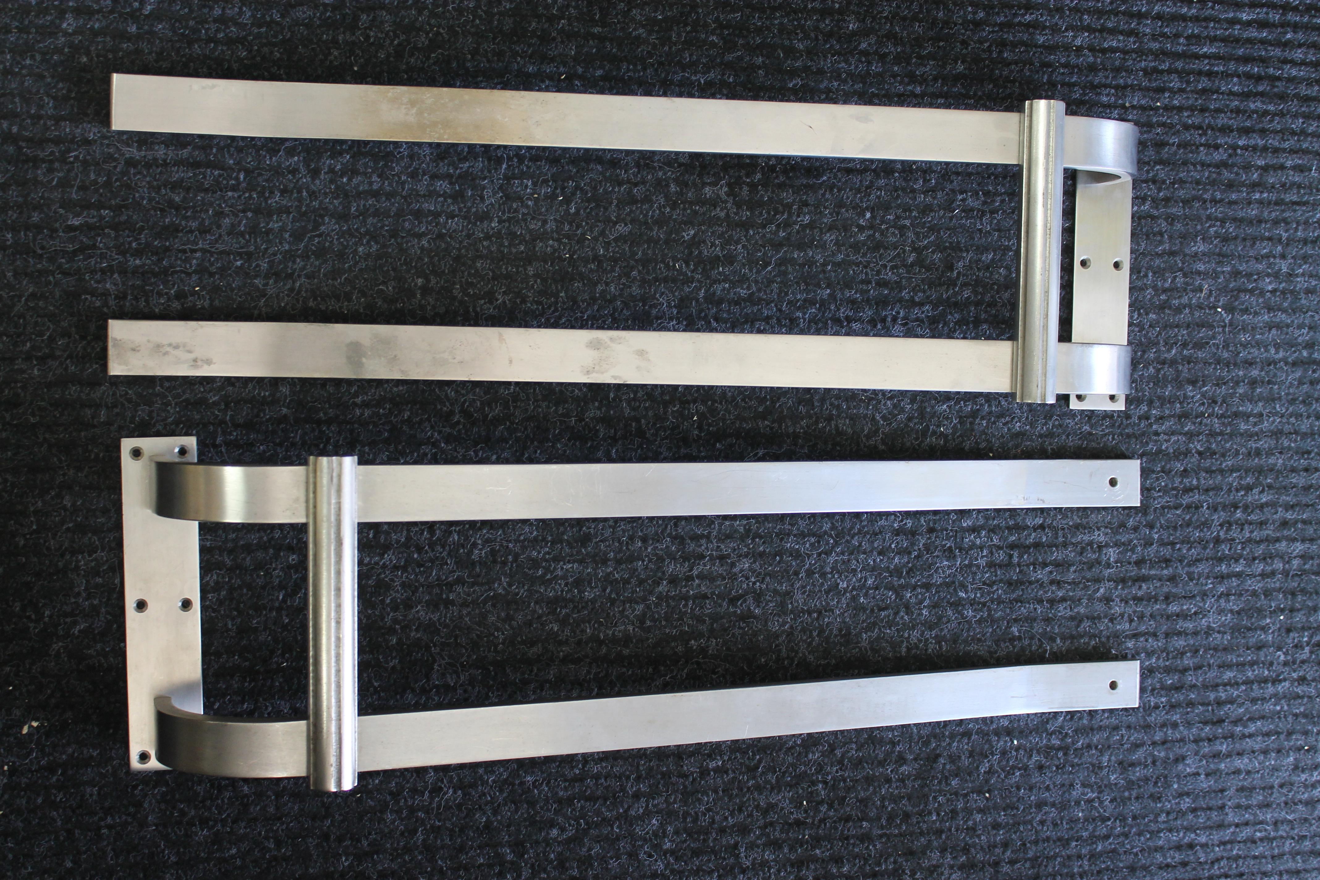 Monumental pair of steel door pulls.  Each door pull measures 9