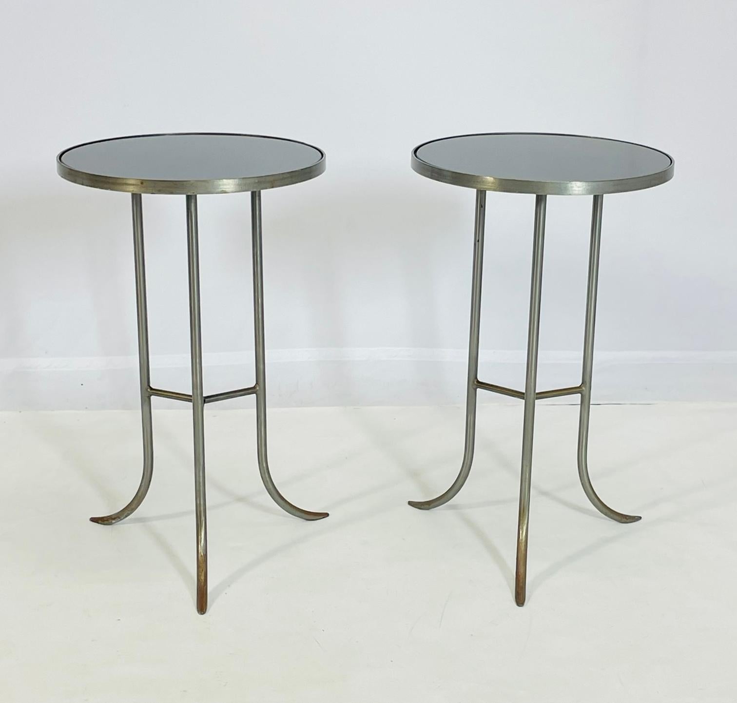 Vintage side or end tables designed and manufactured in Italy in the 1970s.

The tables are made in tubular steel and glass tops.

The pieces are similar in design to those made by Cedric Harman.

The tables are labeled 