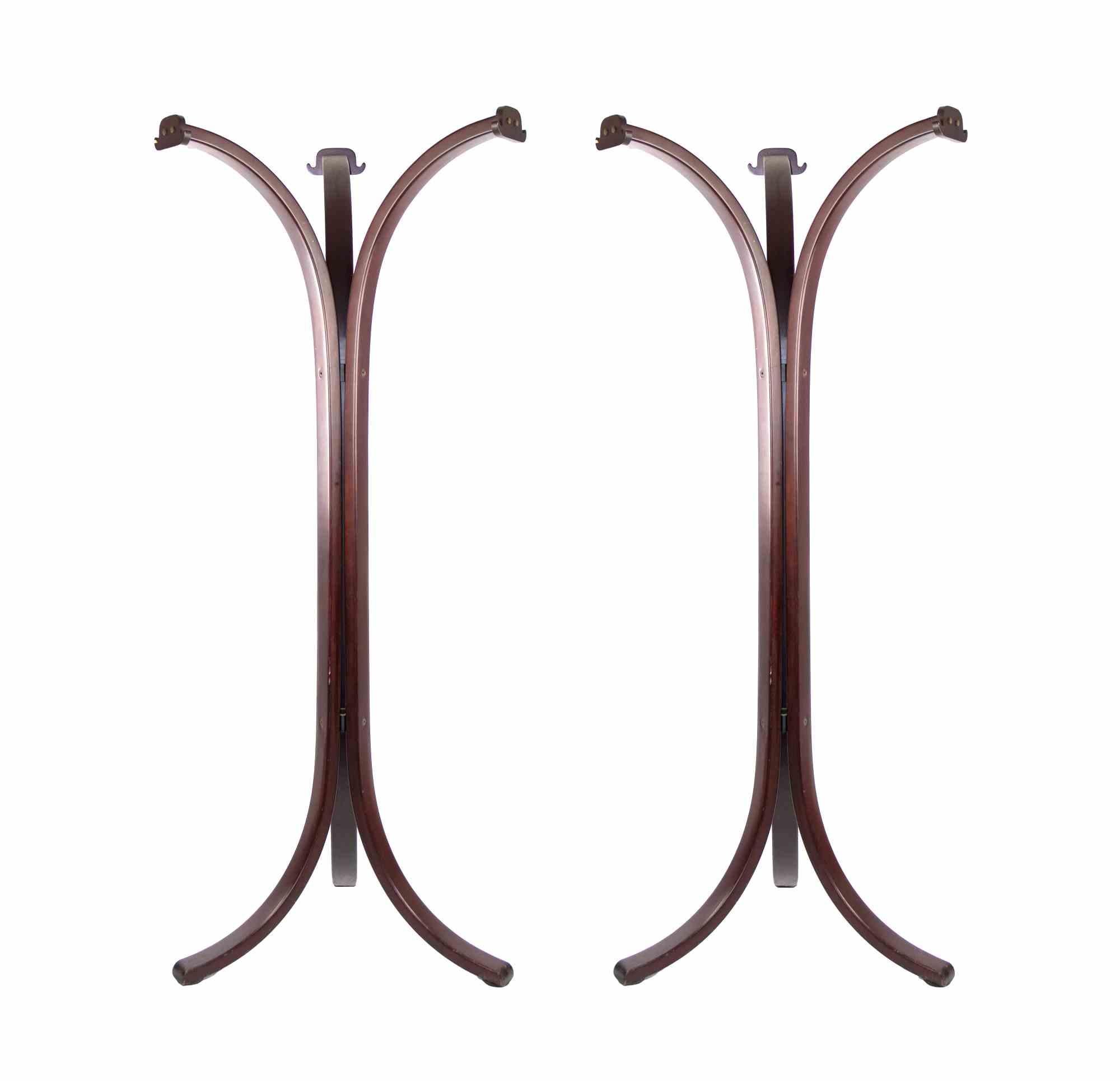 Pair of Steel Hangers is an original design furniture realized in the 1970s. 

A beautiful vintage couple of hangers realized in burgundy colored steel.

Made in Italy.

Good conditions.
 